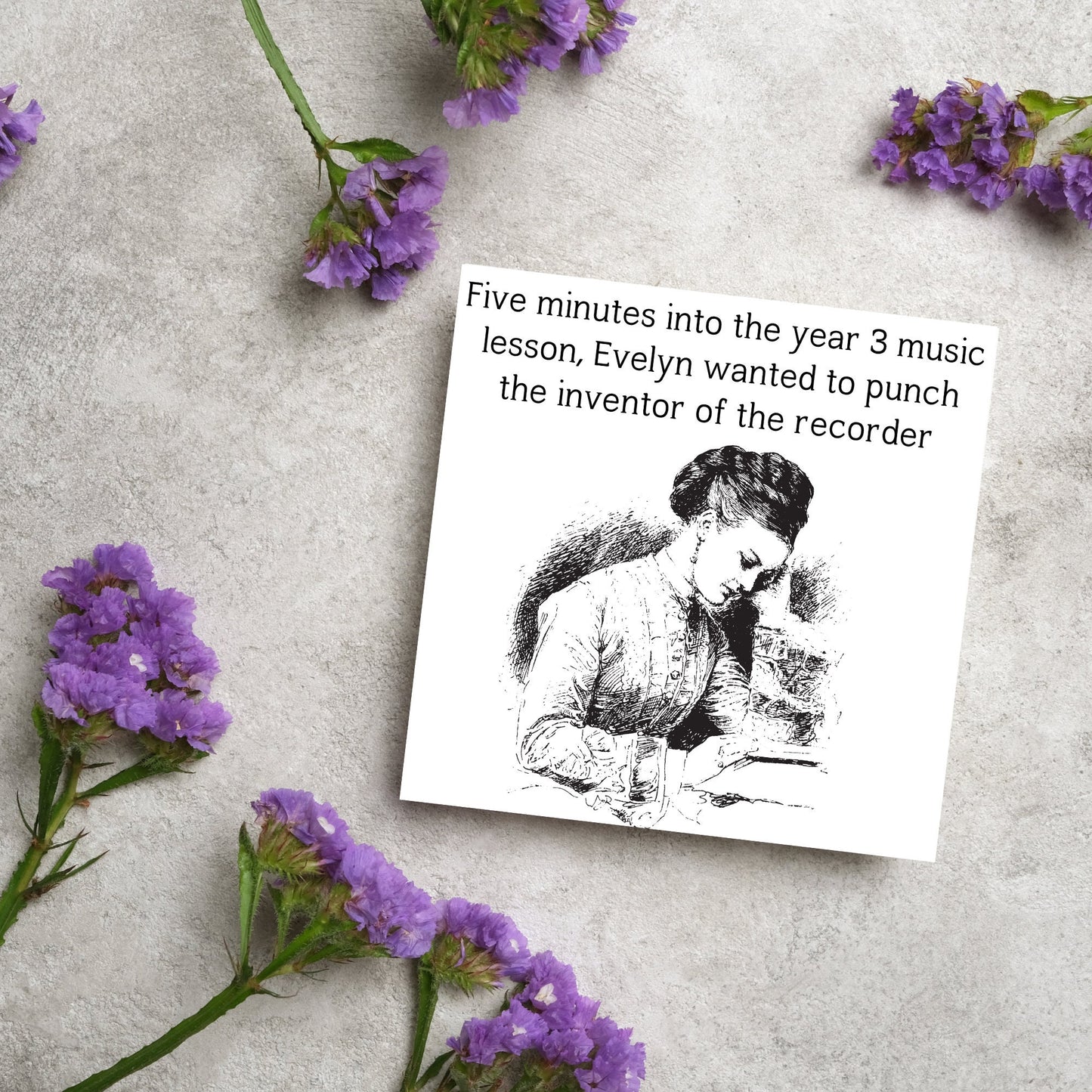 Image of a square greetings card with a black and white line drawing of a victorian lady sitting at a desk with her head in her hands and the text - five minutes into the tear 3 music lesson, evelyn wanted to punch the inventor of the recorder