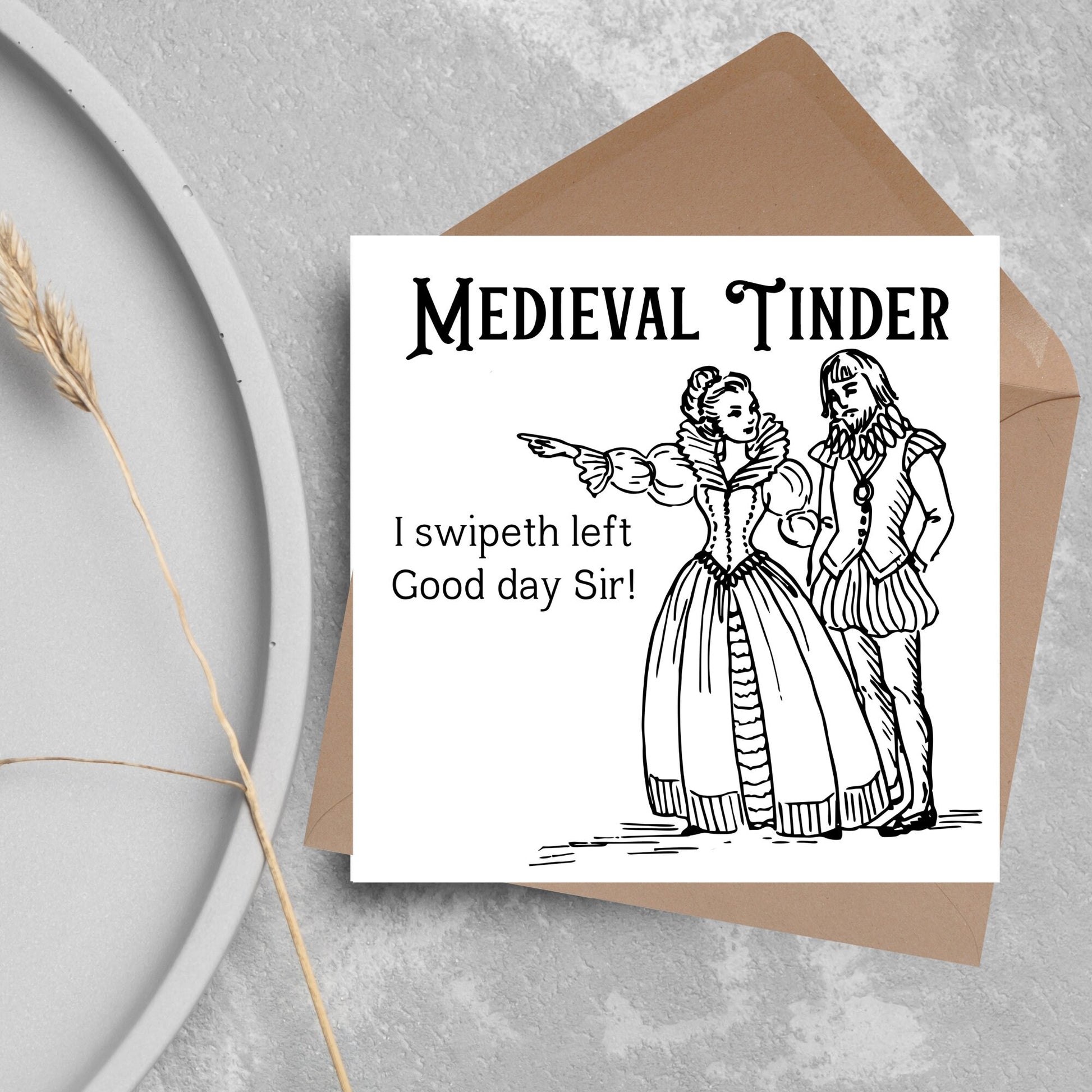 image of a square greetings card with a black and white hand drawn vintage style illustration of medieval man and woman, the woman pointing left and the text - medieval tinder. I swipeth left. Good day Sir! - in a vintage blackletter font