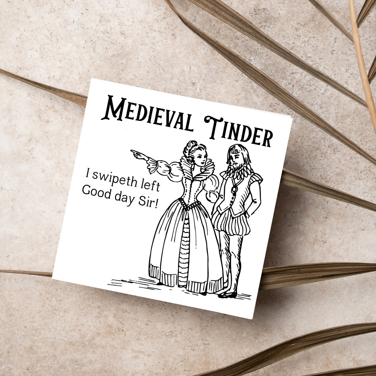 image of a square greetings card with a black and white hand drawn vintage style illustration of medieval man and woman, the woman pointing left and the text - medieval tinder. I swipeth left. Good day Sir! - in a vintage blackletter font