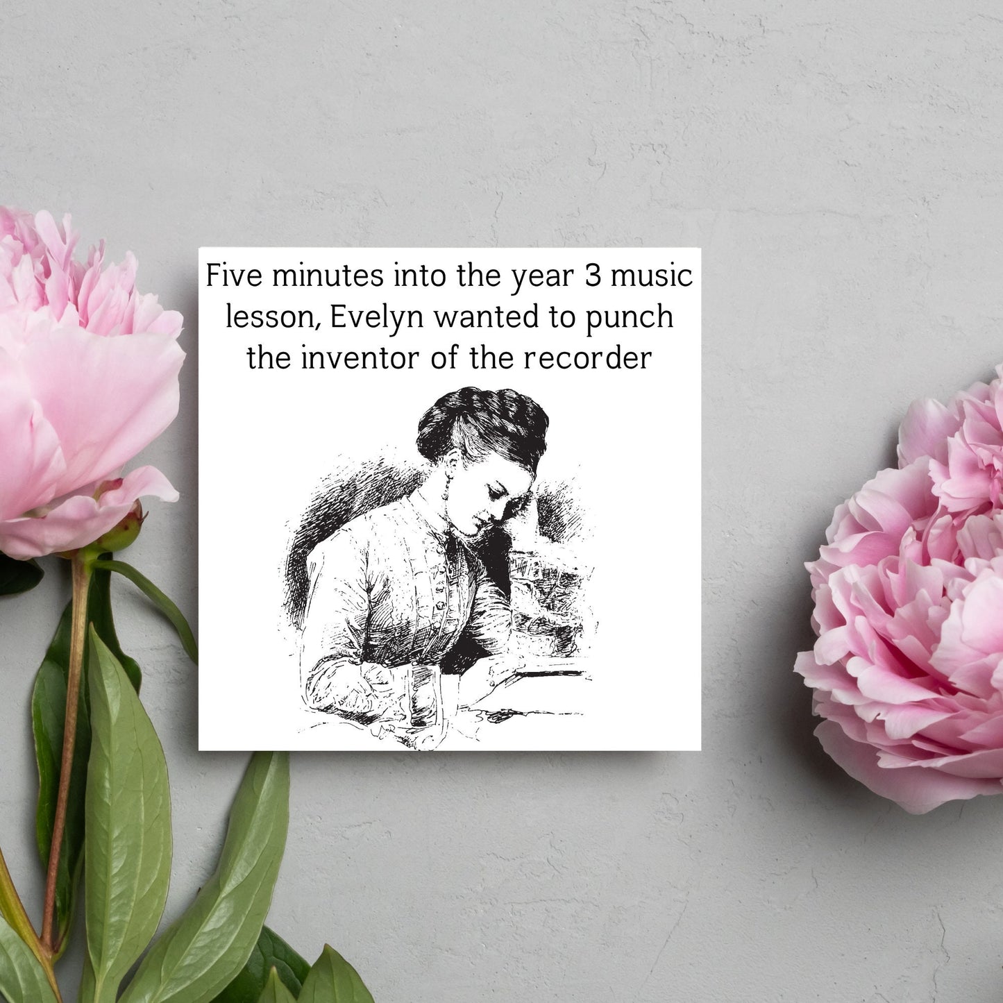 Image of a square greetings card with a black and white line drawing of a victorian lady sitting at a desk with her head in her hands and the text - five minutes into the tear 3 music lesson, evelyn wanted to punch the inventor of the recorder