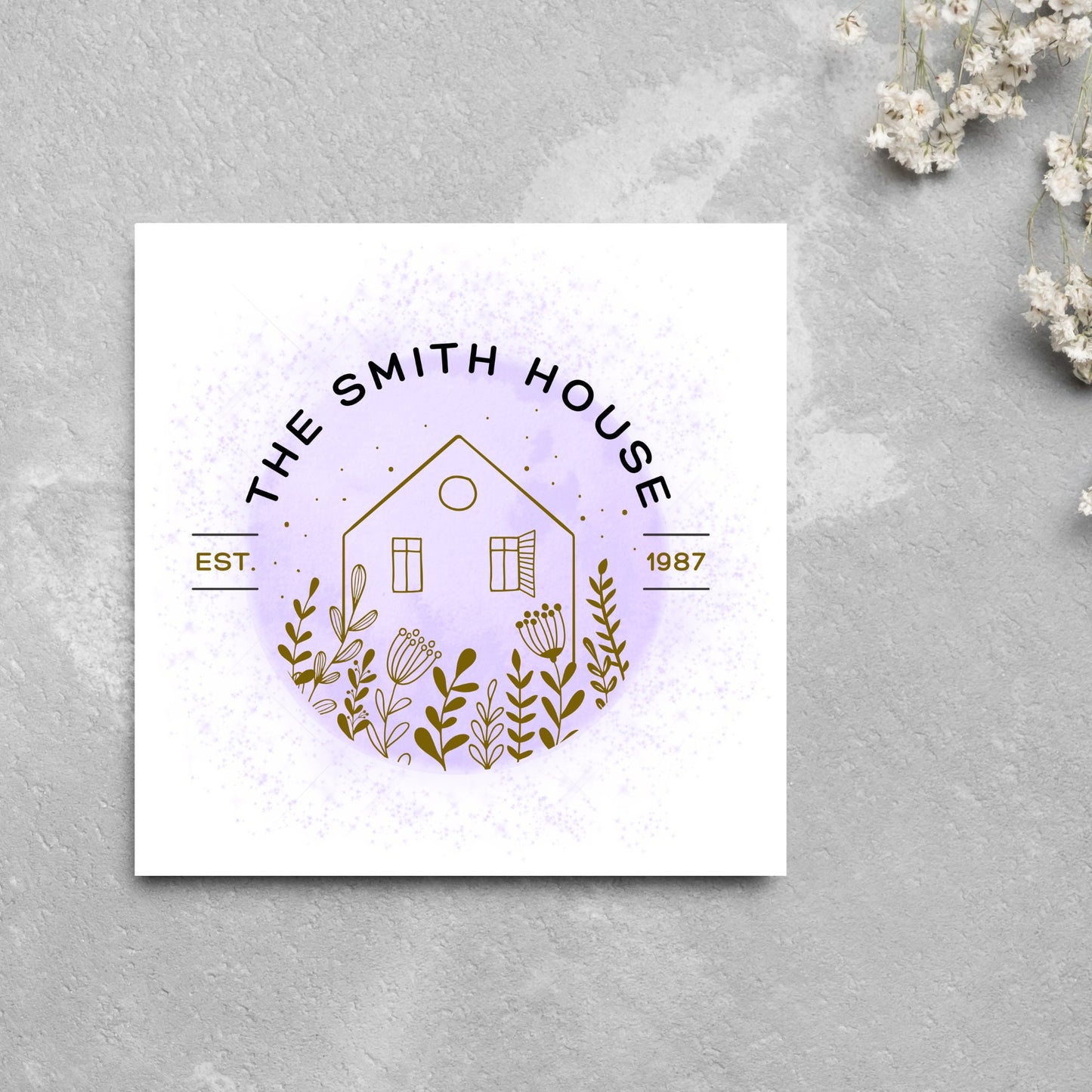 square card with a purple watercolour circle with a line drawing of a house and foliage over it. Arched text reads the smith house on top with est 1987 running through the centre