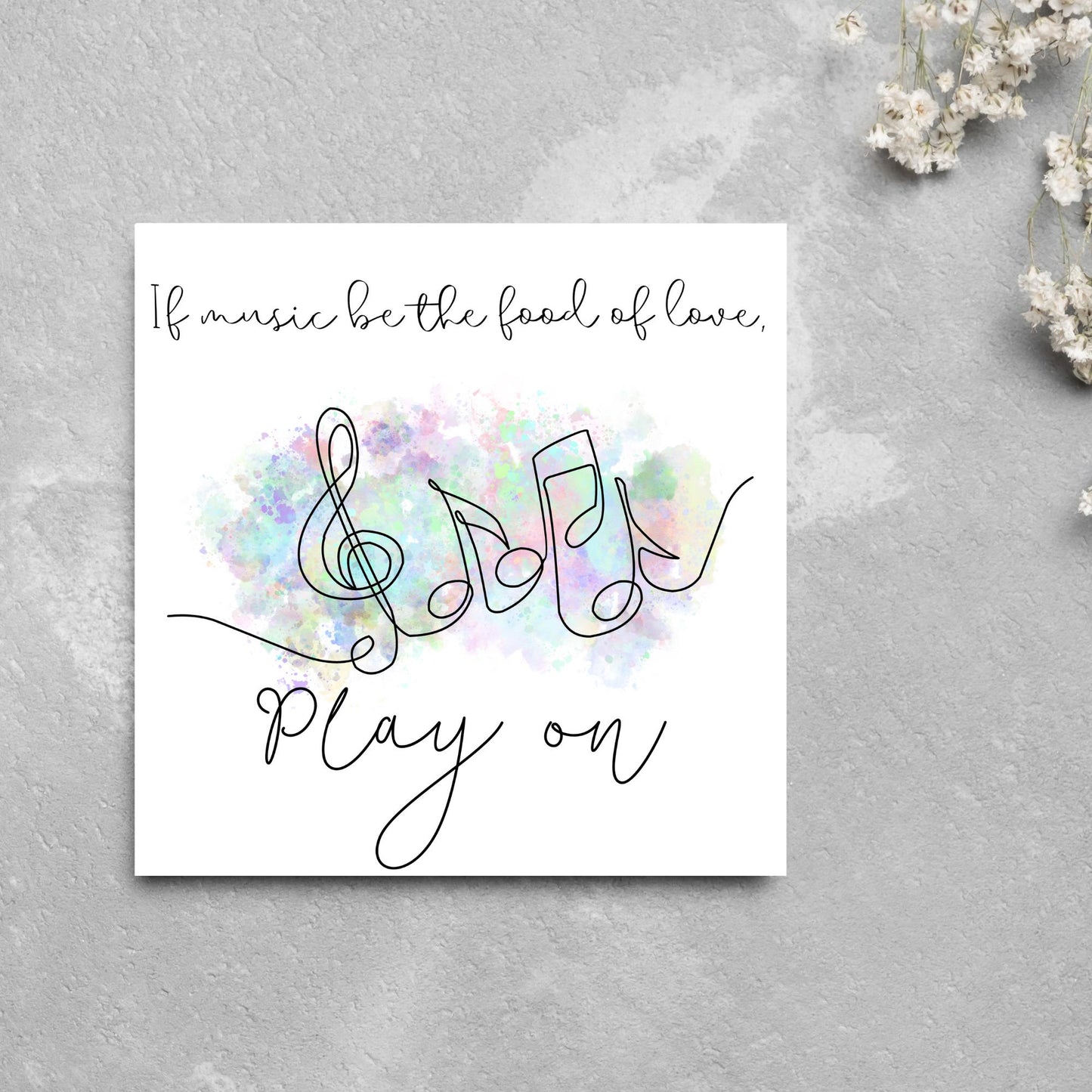 White square card with a one line drawing of musical notes that look like they are dancing in front of a pastel rainbow watercolour cloud. Cursive text reads, If music be the food of love, play on