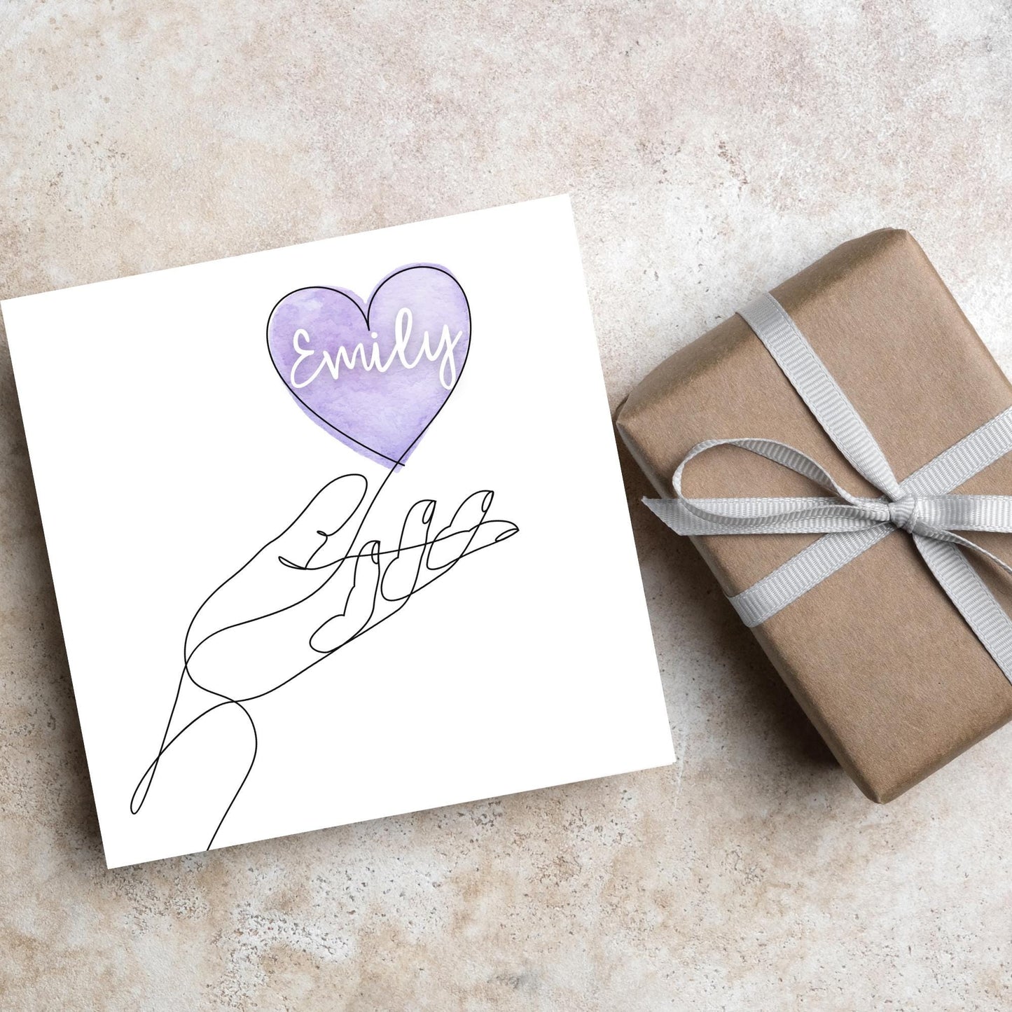 square card with a simple black and white one line drawing of an open hand with a heart rising from the hand. the heart has a purple background and has a personalised name written in a white cursive text