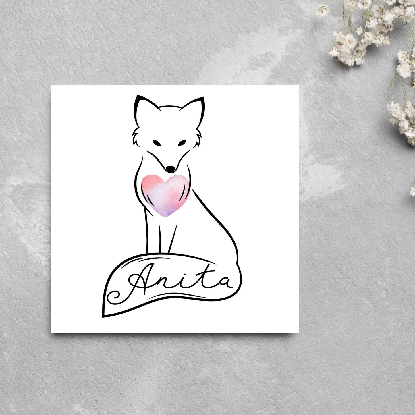 Square card with simple black line drawing of a fox sitting with its tail wrapped around its feet. It has a pink watercolour heart on its chest and personalised with a name on the tail in a calligraphy font