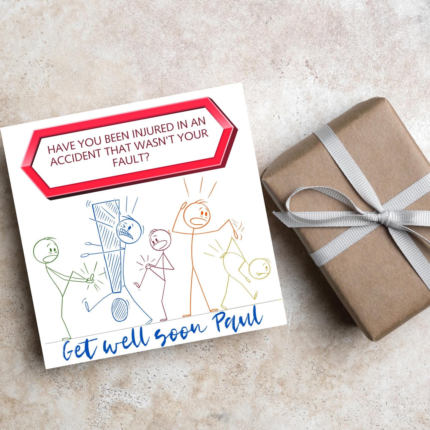 Square Get well soon card with a red sign which says have you been injured in an accident that wasn't your fault? above stick person cartoons of various injuries. Underneath is a handwritten style message that reads get well soon paul