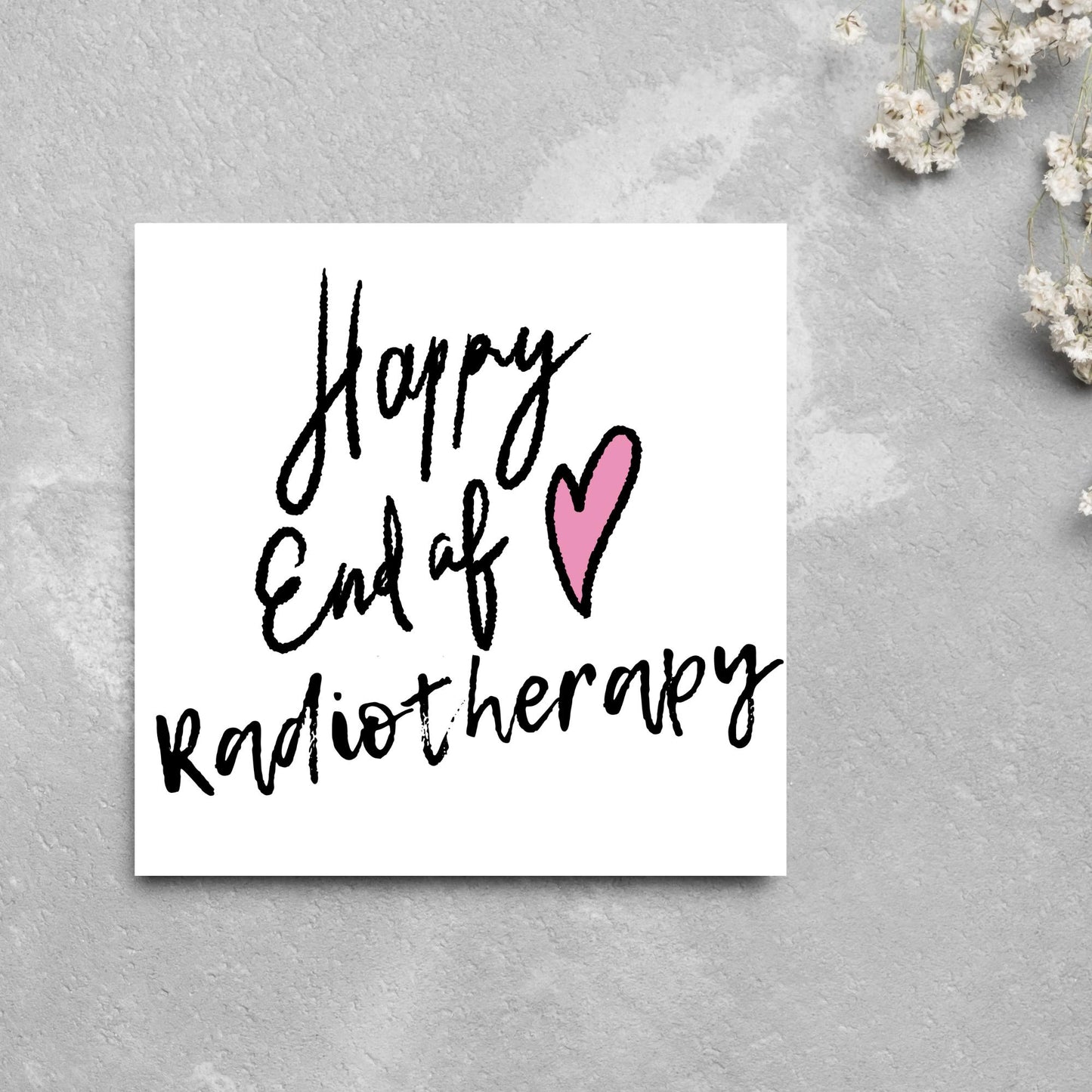 Simple square card with a white backdrop and black handwritten style text that reads HAPPY END OF RADIOTHERAPY with a roughly drawn pink heart next to the text.