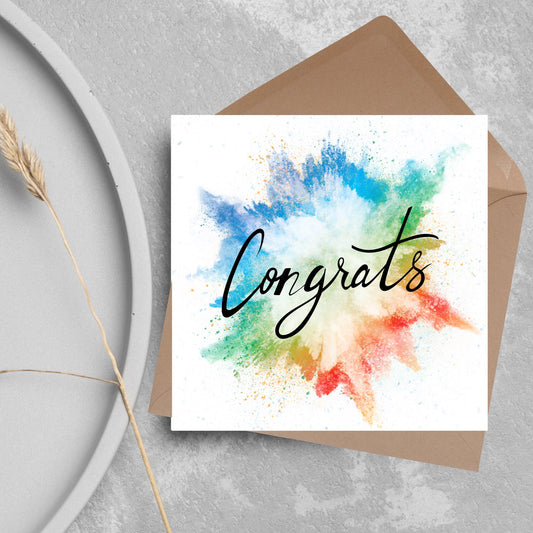 square card with rainbow paint splash against a white background. Black calligraphy style text overlay the paint with congrats