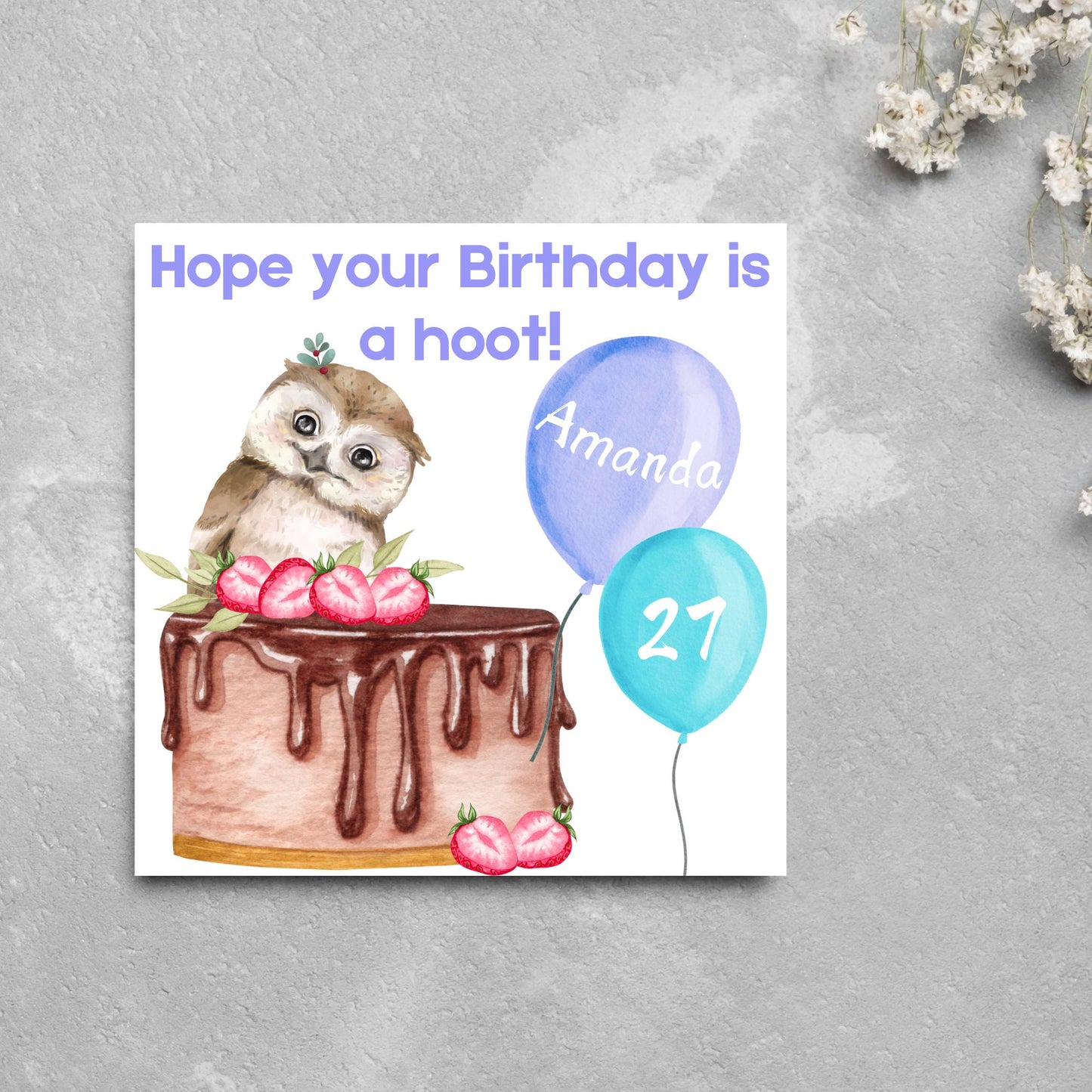 square birthday card with a cute owl sitting on a chocolate cake with the text hope our birthday is a hoot. next to the owl are two blue balloons, one with the name of the person and one with the age in white writing