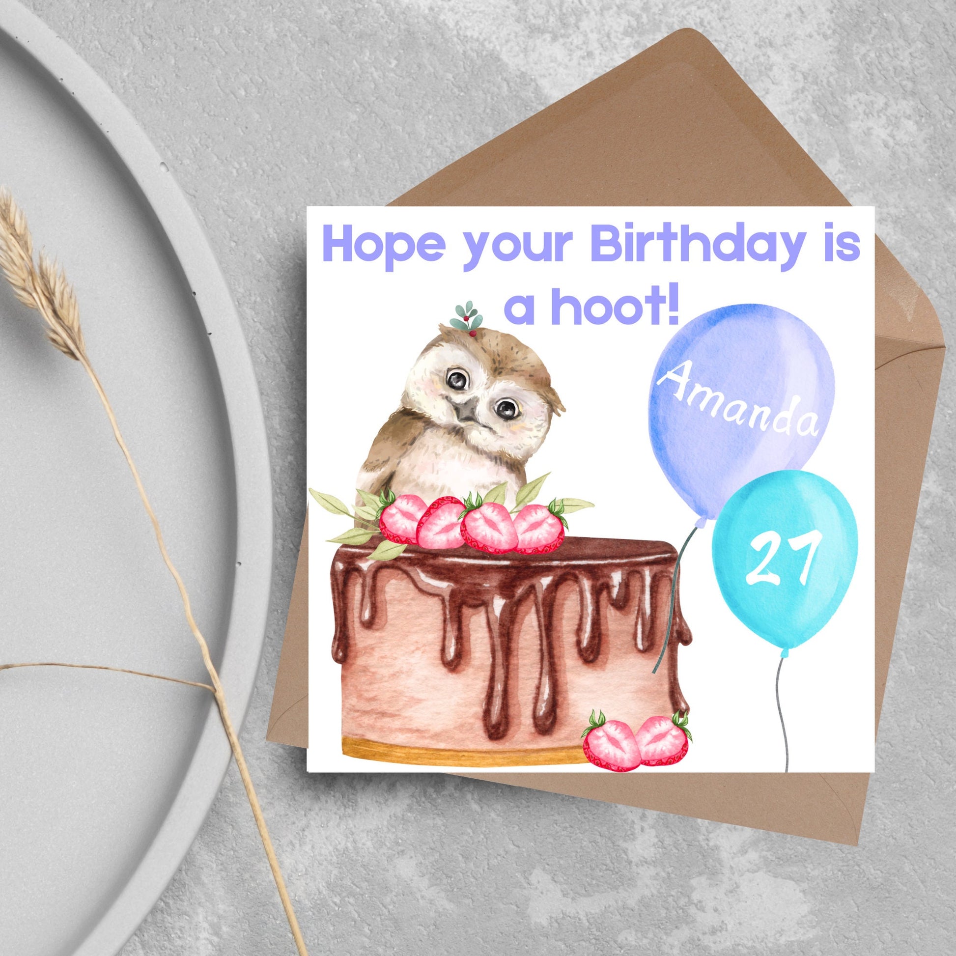 square birthday card with a cute owl sitting on a chocolate cake with the text hope our birthday is a hoot. next to the owl are two blue balloons, one with the name of the person and one with the age in white writing