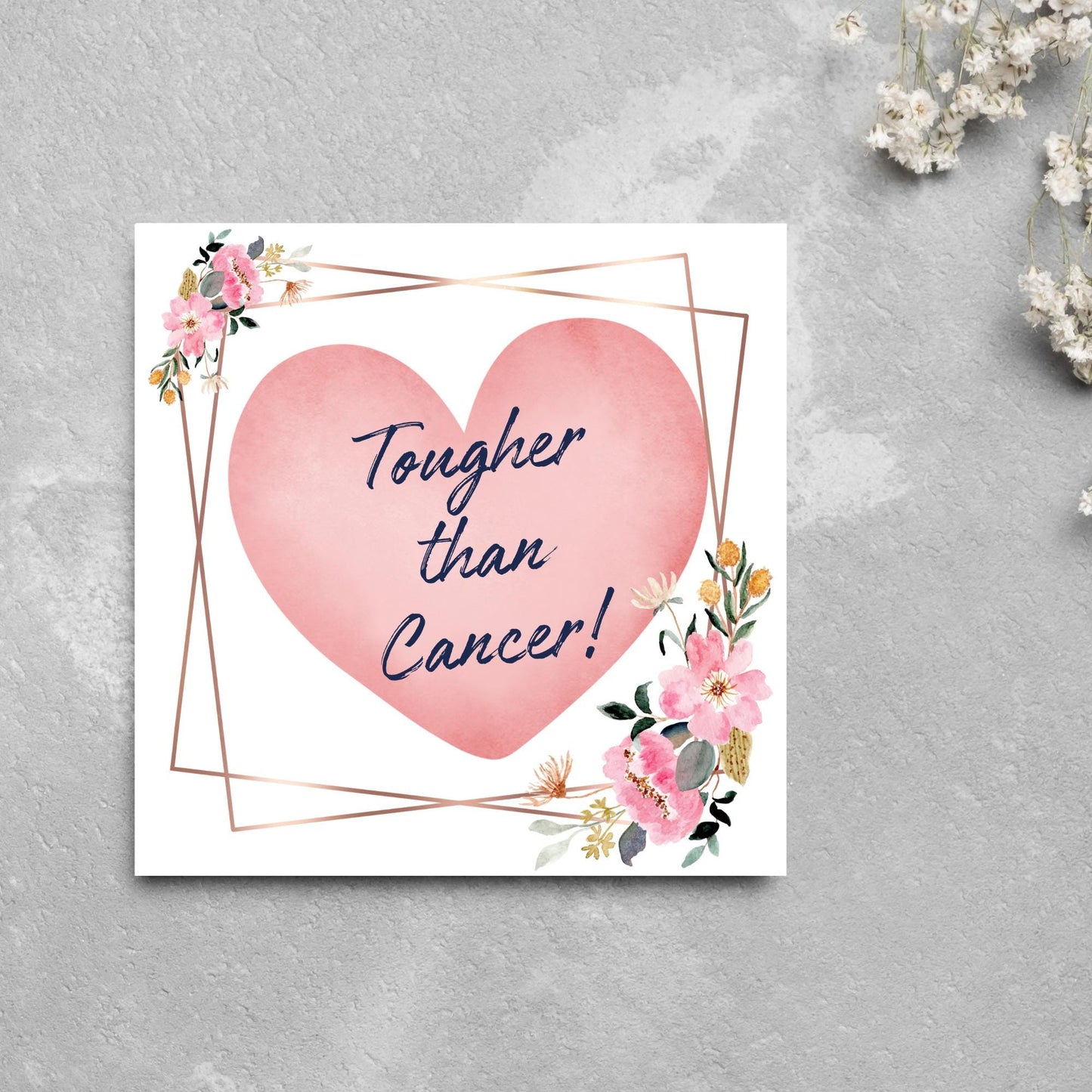 Square white card with a watercolour floral border frame and a pink heart in the centre with the text Tougher than cancer in s handwritten style navy blue font