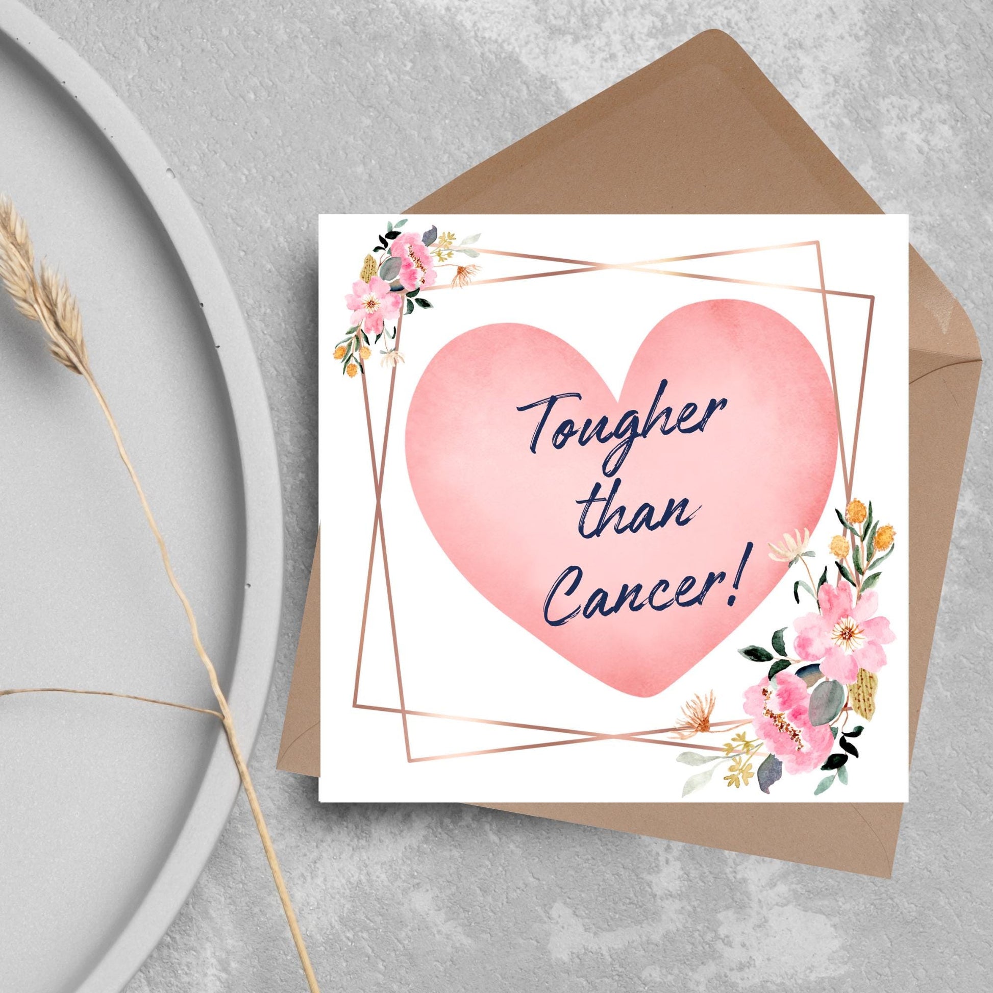 Square white card with a watercolour floral border frame and a pink heart in the centre with the text Tougher than cancer in s handwritten style navy blue font