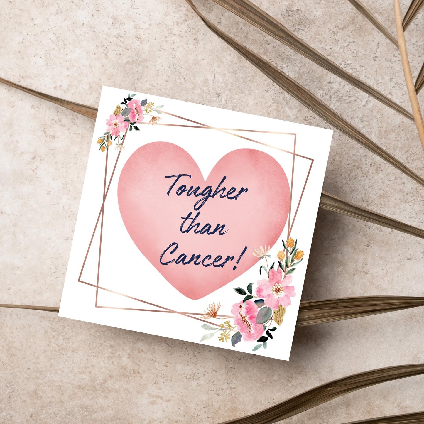 Square white card with a watercolour floral border frame and a pink heart in the centre with the text Tougher than cancer in s handwritten style navy blue font