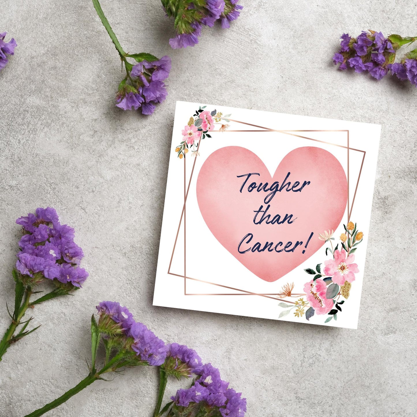 Square white card with a watercolour floral border frame and a pink heart in the centre with the text Tougher than cancer in s handwritten style navy blue font