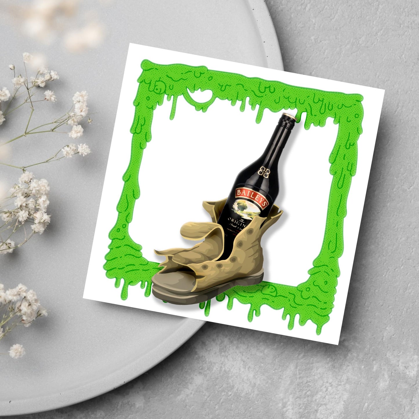 image of a square greetings card with a green slime frame with an image of an old boot with a bottle of baileys inside it