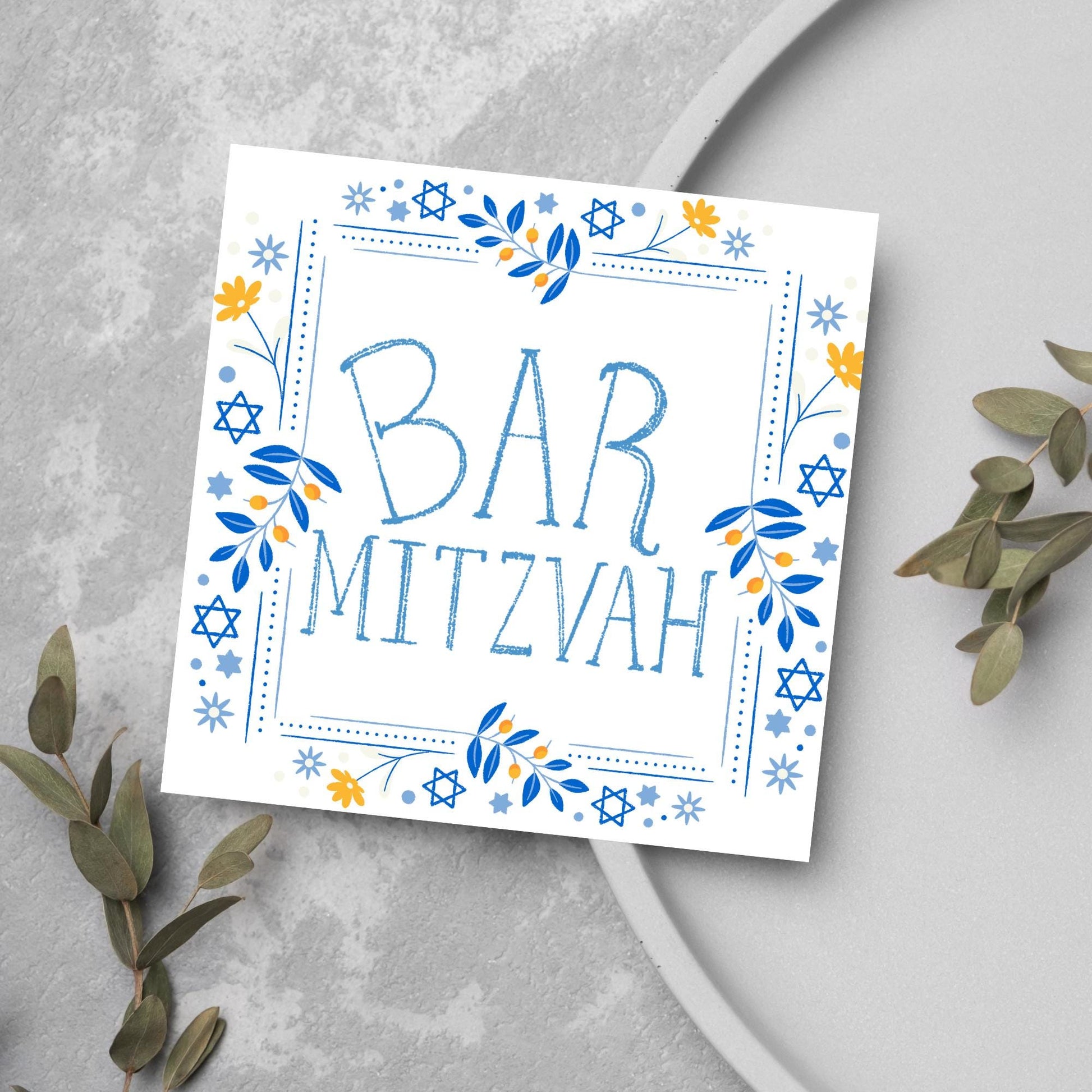square bar mitzvah card with a sketchy drawn bar mitzvah in the centre in a soft blue, with a decorative frame featuring flowers and stars of david in blues and yellows