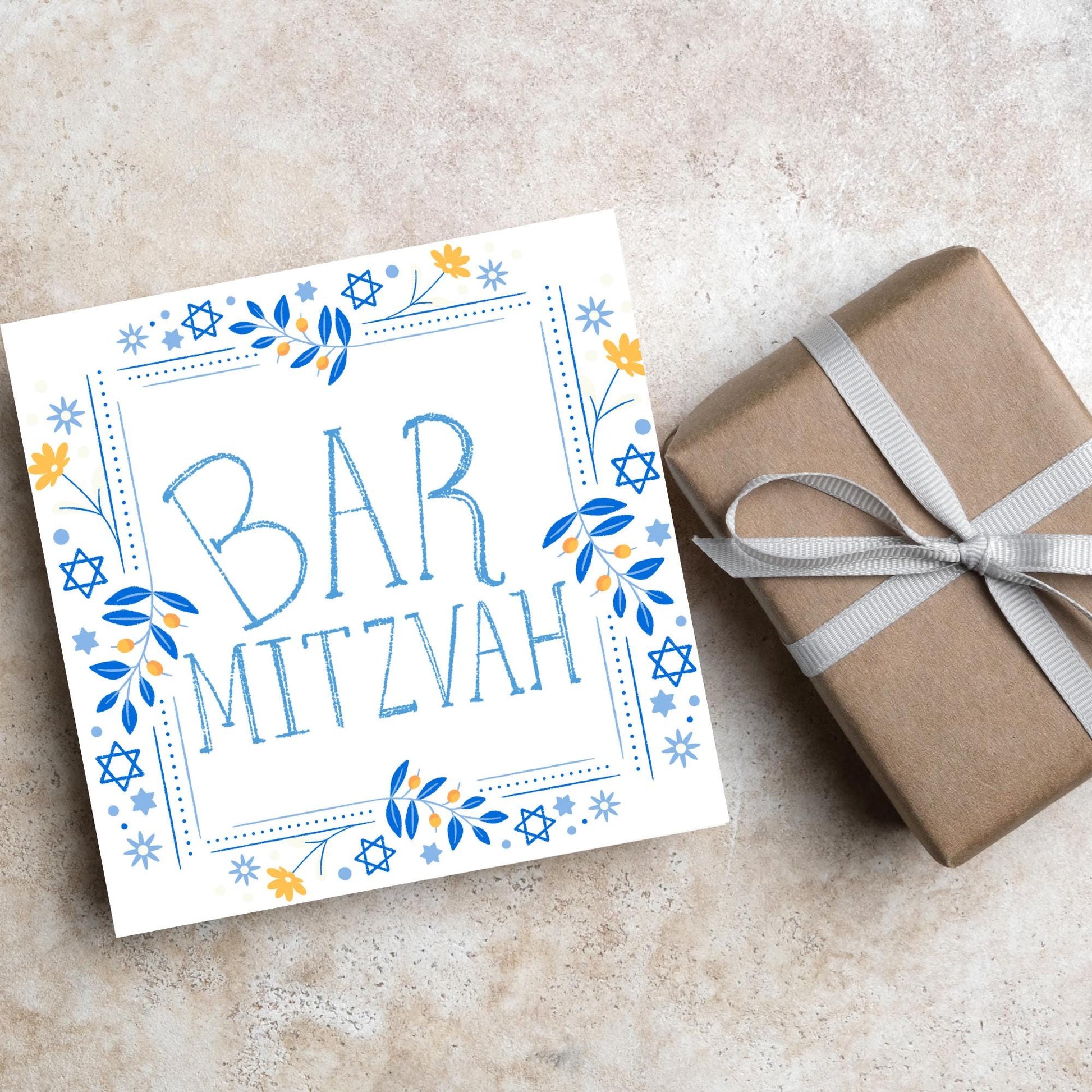 square bar mitzvah card with a sketchy drawn bar mitzvah in the centre in a soft blue, with a decorative frame featuring flowers and stars of david in blues and yellows