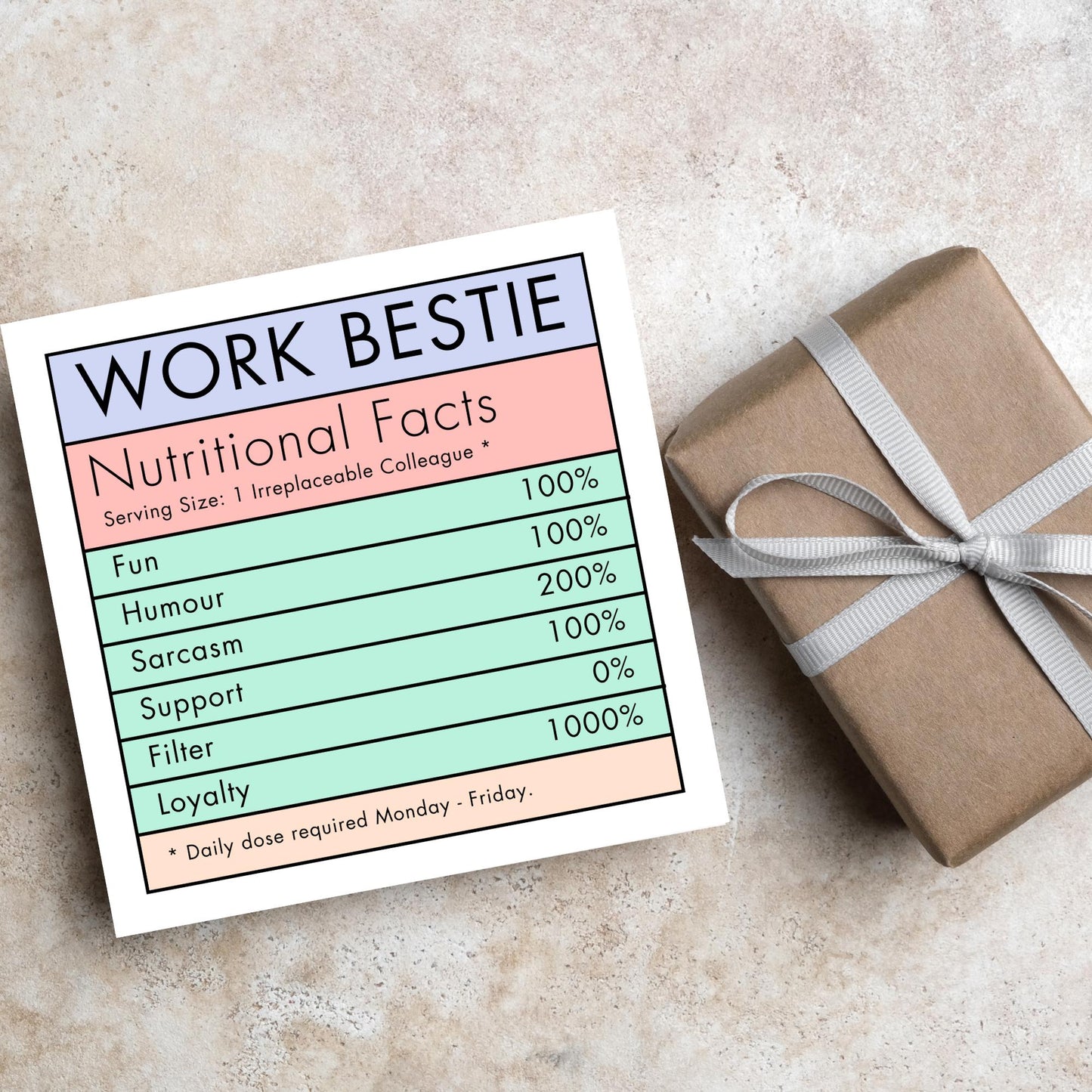 Square card with a nutritional information style graphic that reads work bestie, nutritional facts, (serving size 1 colleague) fun 100%, Humour 100%, sarcasm 200%, support 100%, filter 0%, loyalty 1000%. daily dose required monday - friday