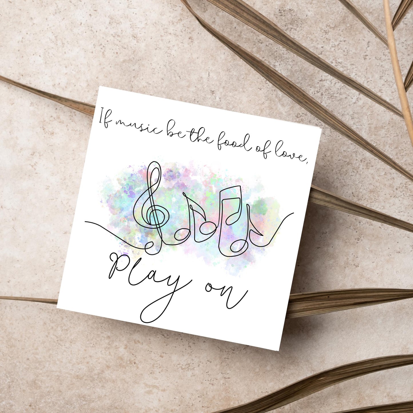 White square card with a one line drawing of musical notes that look like they are dancing in front of a pastel rainbow watercolour cloud. Cursive text reads, If music be the food of love, play on