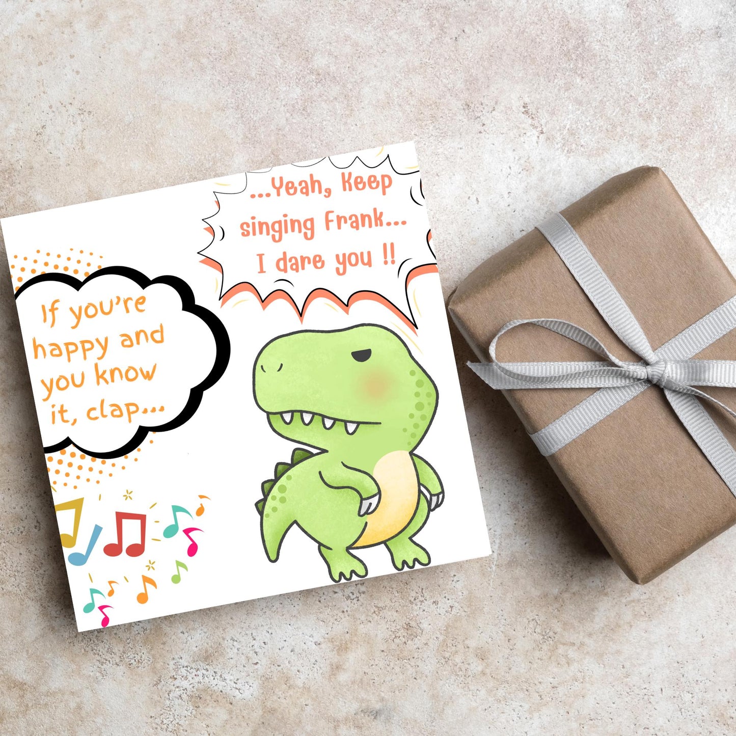 A cute, grumpy green T-Rex with tiny arms is featured. Text reads, "If you're happy and you know it, clap..." The T-Rex responds, "...Yeah, keep singing Frank... I dare you!!" Musical notes add a playful touch.