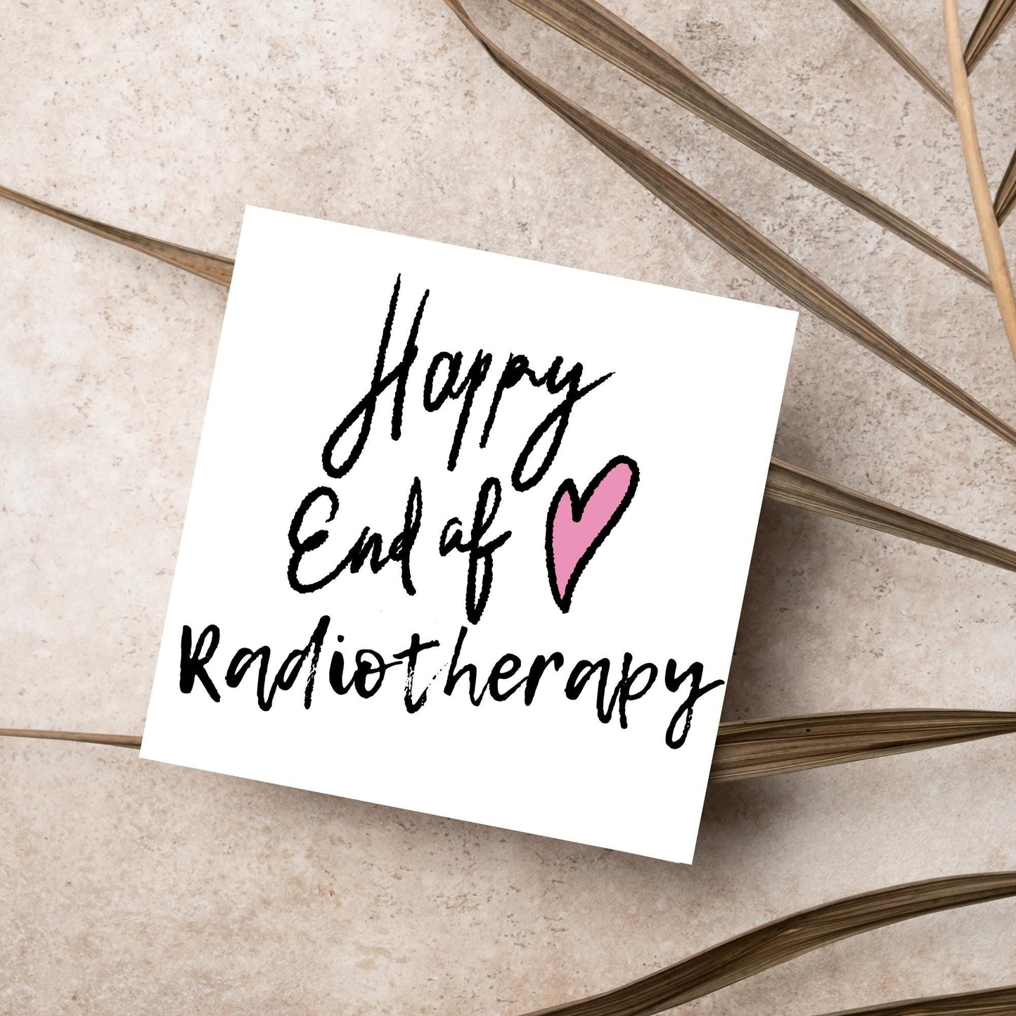 Simple square card with a white backdrop and black handwritten style text that reads HAPPY END OF RADIOTHERAPY with a roughly drawn pink heart next to the text.