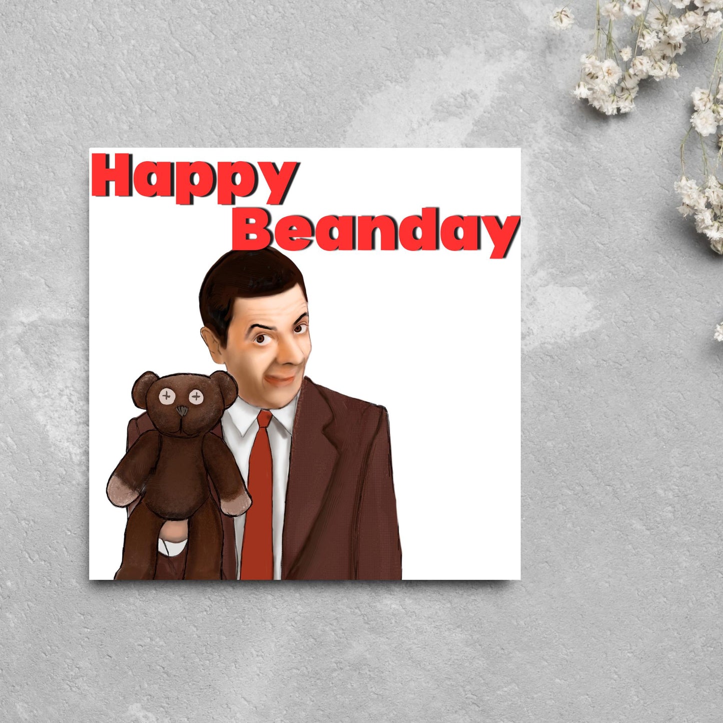 square card with a hand drawn image of Mr bean holding his teddy pooky with a cheeky smile on his face with the words Happy Beanday above in bold red text