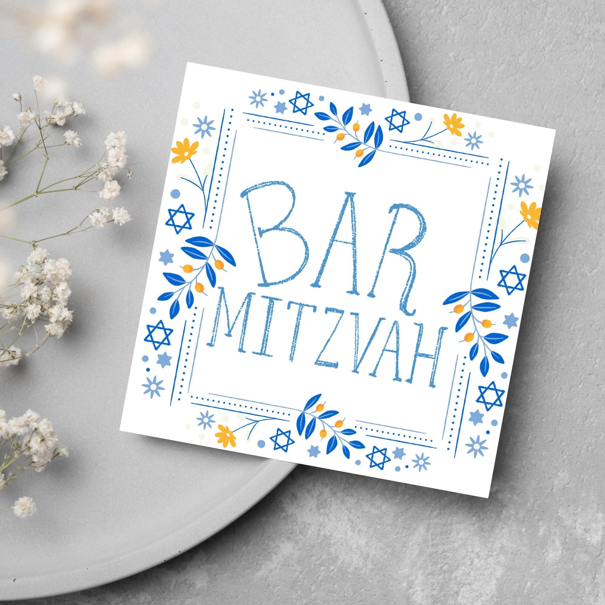 square bar mitzvah card with a sketchy drawn bar mitzvah in the centre in a soft blue, with a decorative frame featuring flowers and stars of david in blues and yellows