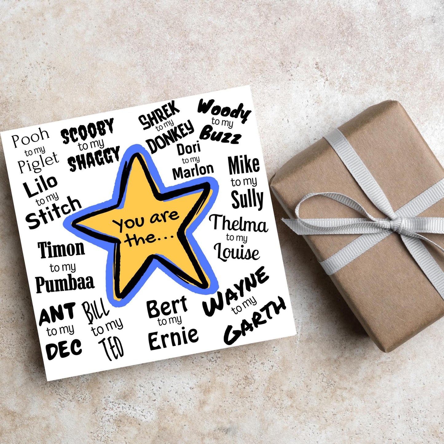 Square card with a blue and yellow star in the centre with black text - you are the... - and various famous friendship duos. for example thelma to my louise, lilo to my stitch, woody to my buzz, pooh to my piglet etc