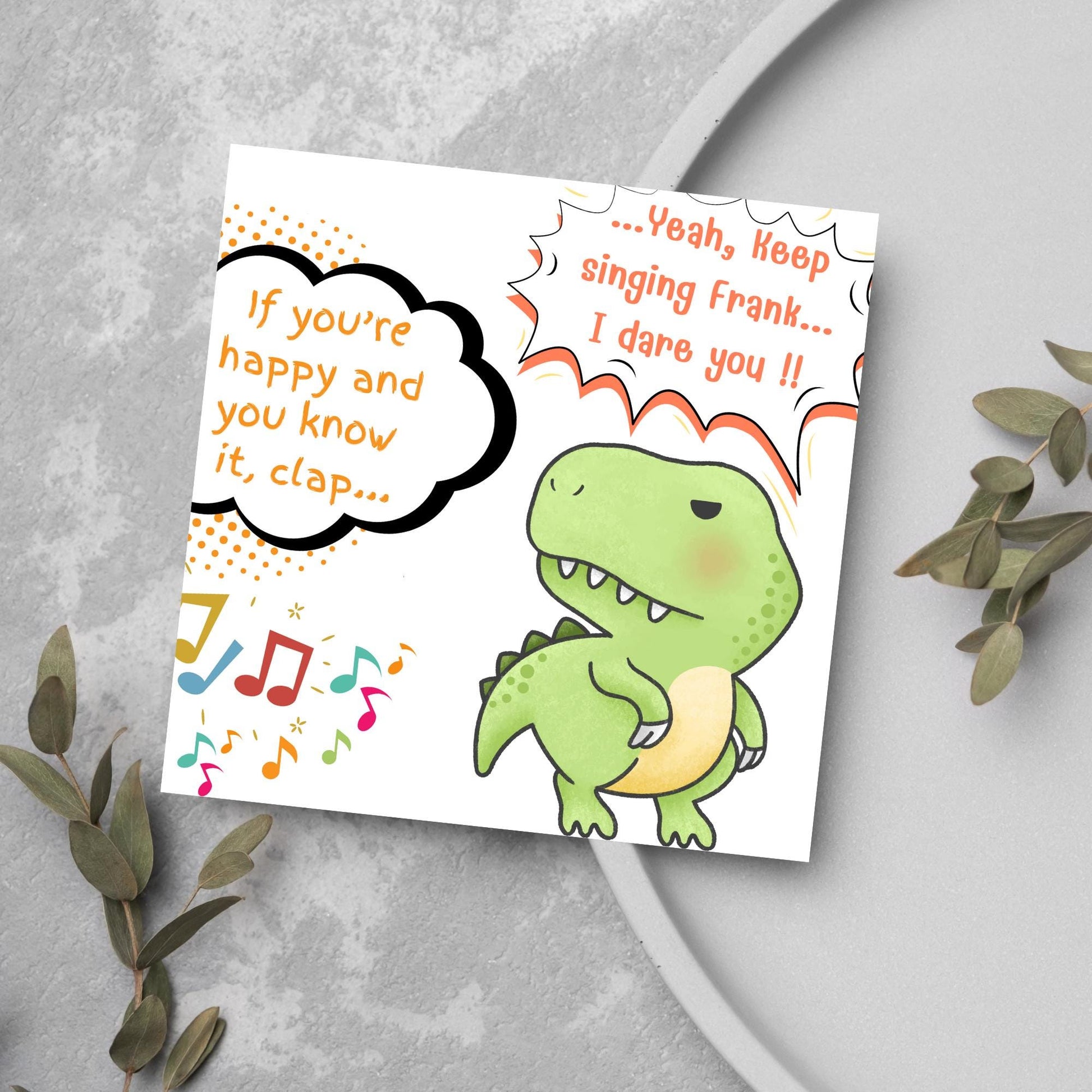 A cute, grumpy green T-Rex with tiny arms is featured. Text reads, "If you're happy and you know it, clap..." The T-Rex responds, "...Yeah, keep singing Frank... I dare you!!" Musical notes add a playful touch.