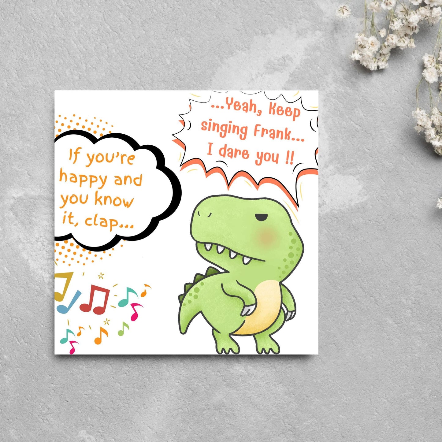 A cute, grumpy green T-Rex with tiny arms is featured. Text reads, "If you're happy and you know it, clap..." The T-Rex responds, "...Yeah, keep singing Frank... I dare you!!" Musical notes add a playful touch.