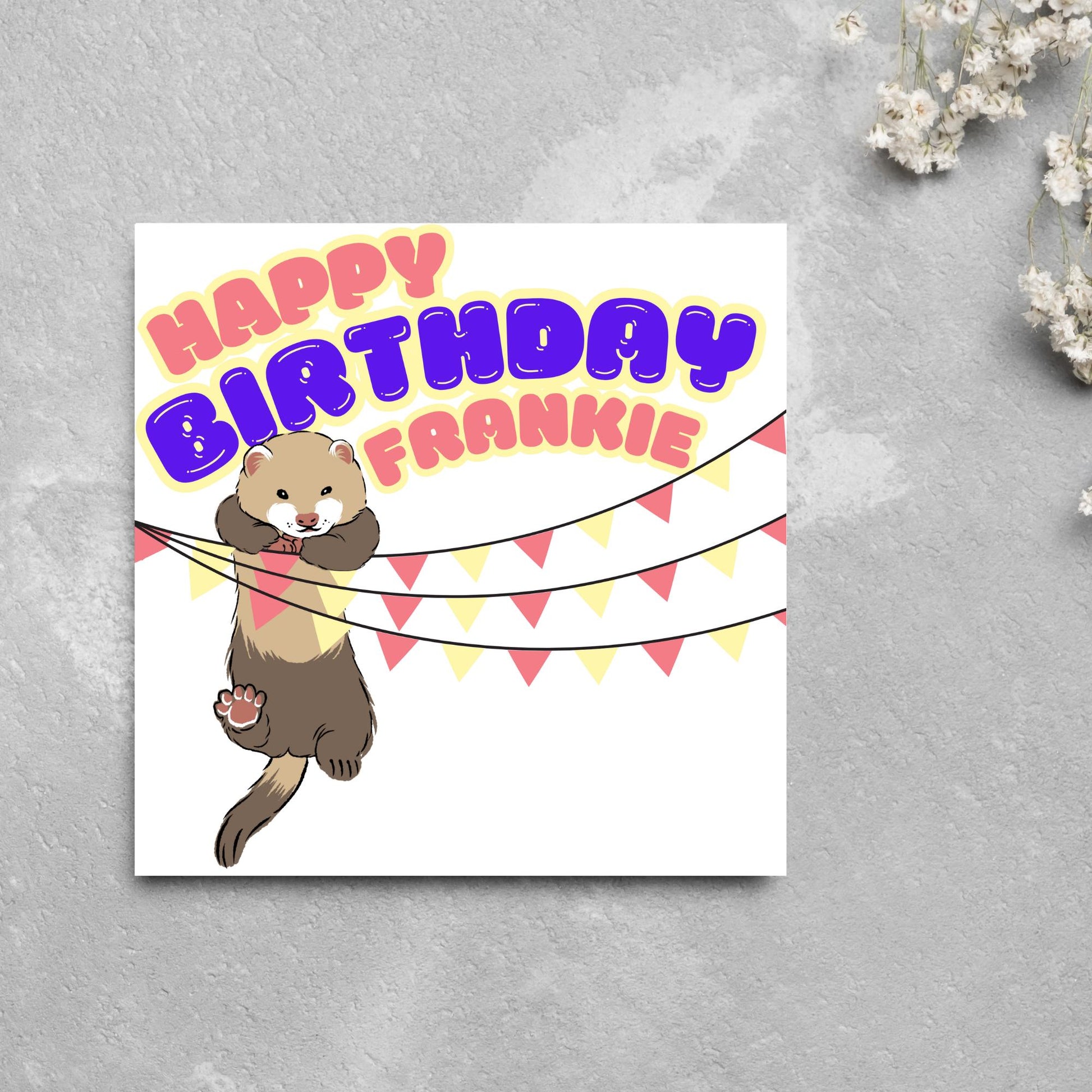 square card with an image of a ferret hanging off pink and yellow bunting with bold pink and purple text above that reads happy birthday frankie in a bubble font