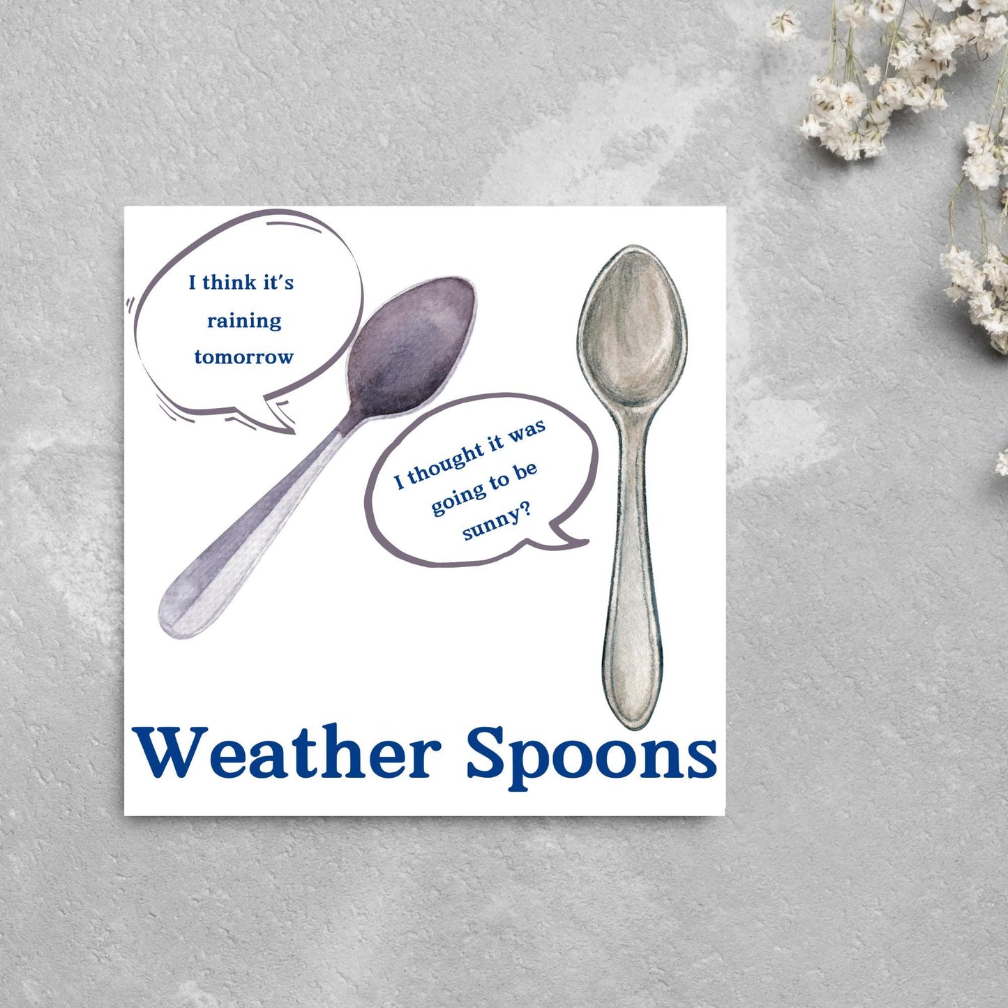 Image of a square greeting card. The card has a white backdrop with an illustration of two spoons with speech bubbles. One says I think it's raining tomorrow. The other says I thought it was going to be sunny? Underneath the illustration in a blue font is the text Weather Spoons