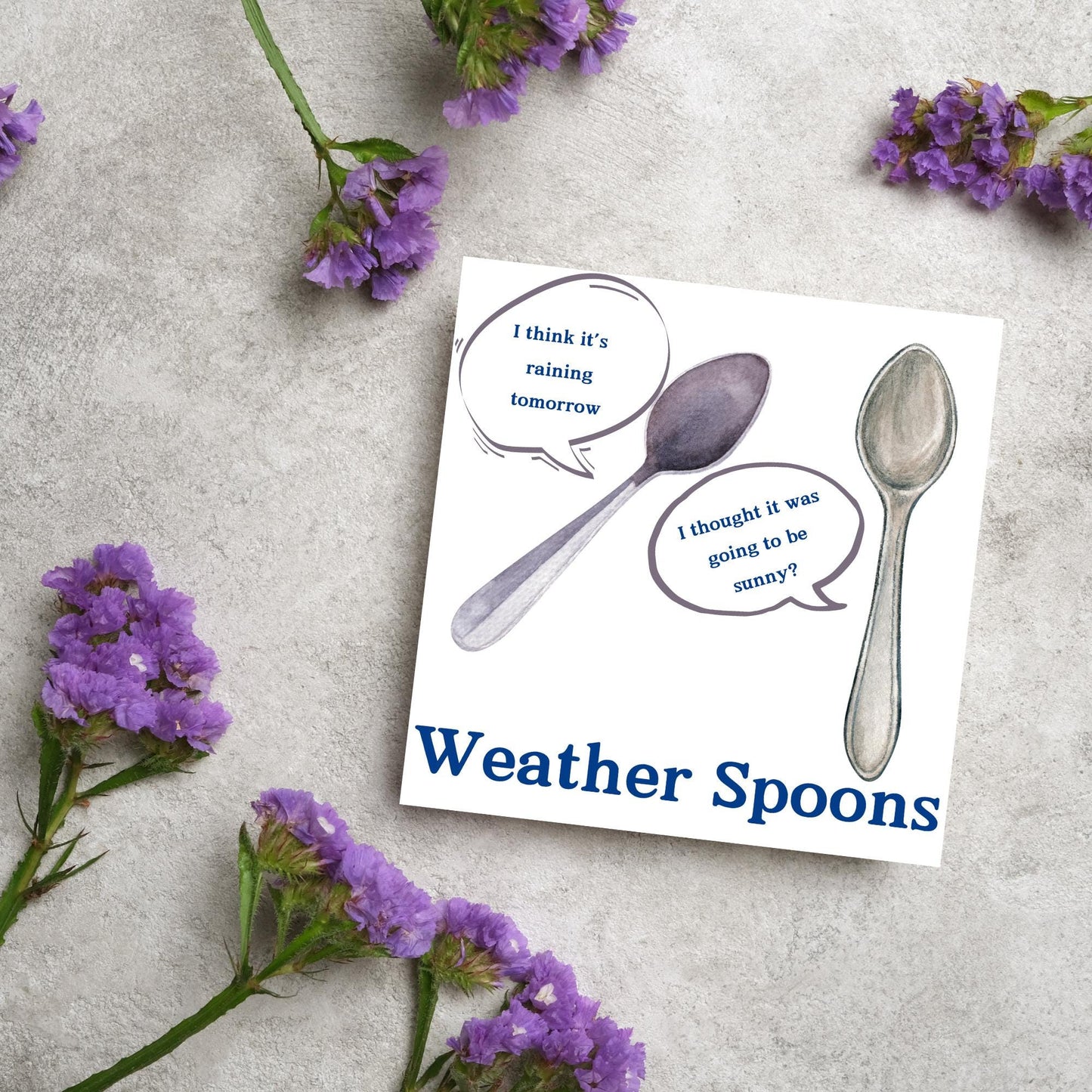 Image of a square greeting card. The card has a white backdrop with an illustration of two spoons with speech bubbles. One says I think it's raining tomorrow. The other says I thought it was going to be sunny? Underneath the illustration in a blue font is the text Weather Spoons