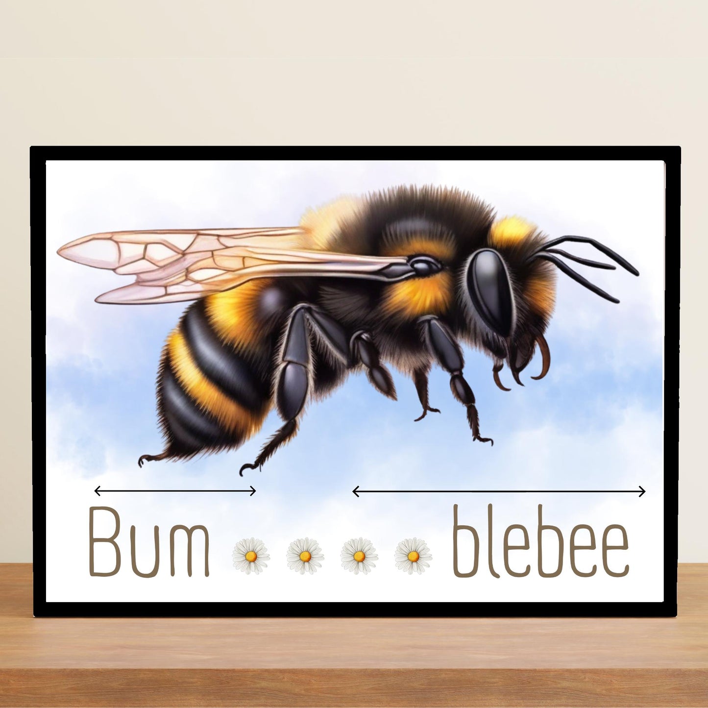 A framed A4 art print featuring a detailed illustration of a bumblebee with soft blue sky in the background. Below the bee, the text playfully reads "Bum" followed by five daisy icons and then "blebee," with arrows pointing across the entire phrase to emphasise the humorous, stretched-out pun