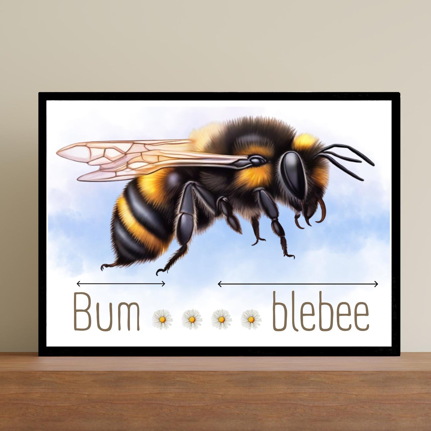 A framed A4 art print featuring a detailed illustration of a bumblebee with soft blue sky in the background. Below the bee, the text playfully reads "Bum" followed by five daisy icons and then "blebee," with arrows pointing across the entire phrase to emphasise the humorous, stretched-out pun
