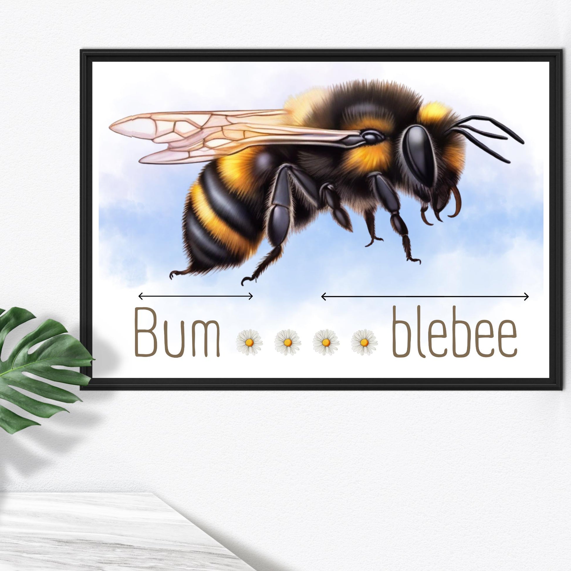A framed A4 art print featuring a detailed illustration of a bumblebee with soft blue sky in the background. Below the bee, the text playfully reads "Bum" followed by five daisy icons and then "blebee," with arrows pointing across the entire phrase to emphasise the humorous, stretched-out pun