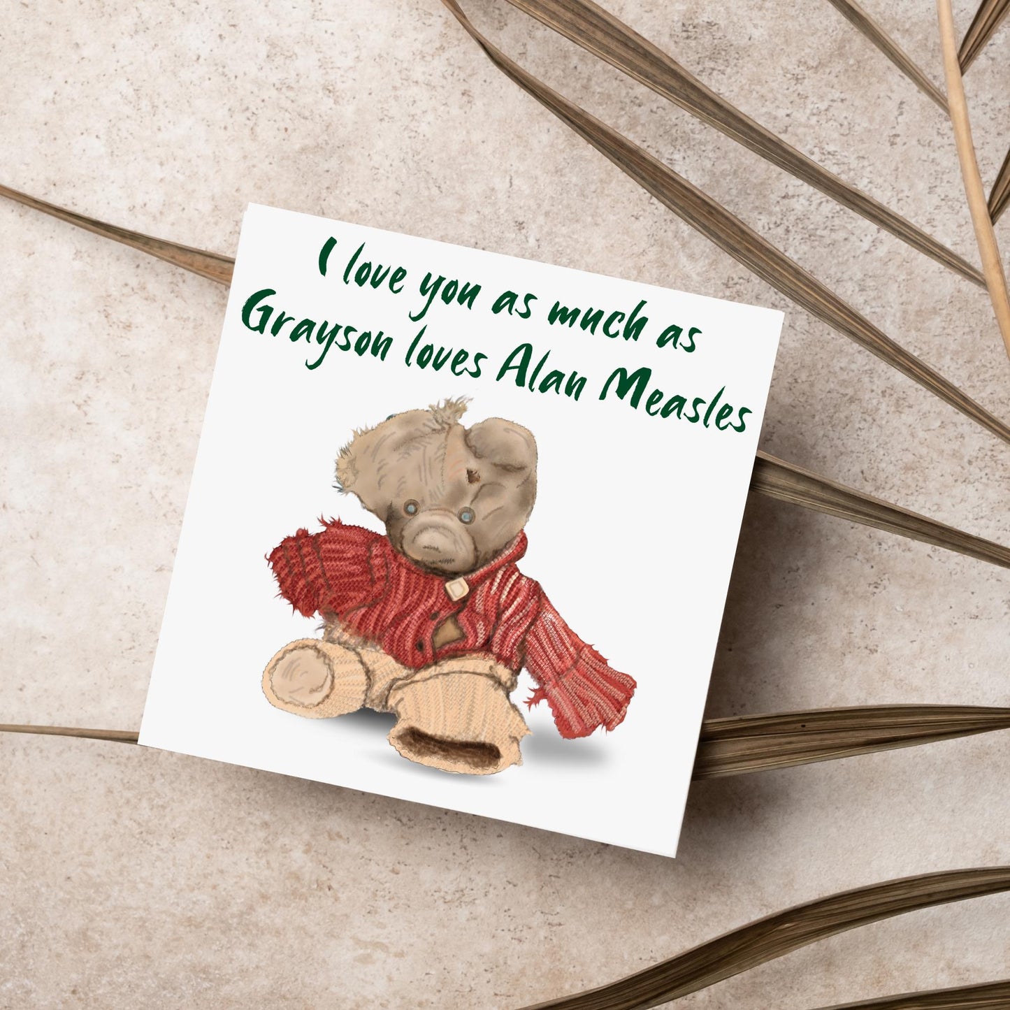 This is an image of a square anniversary card with a hand drawn illustration of Grayson Perry's beloved Alan Measels teddy bear with hand written style that says 'I love you as much as Grayson loves Alan Measels'.