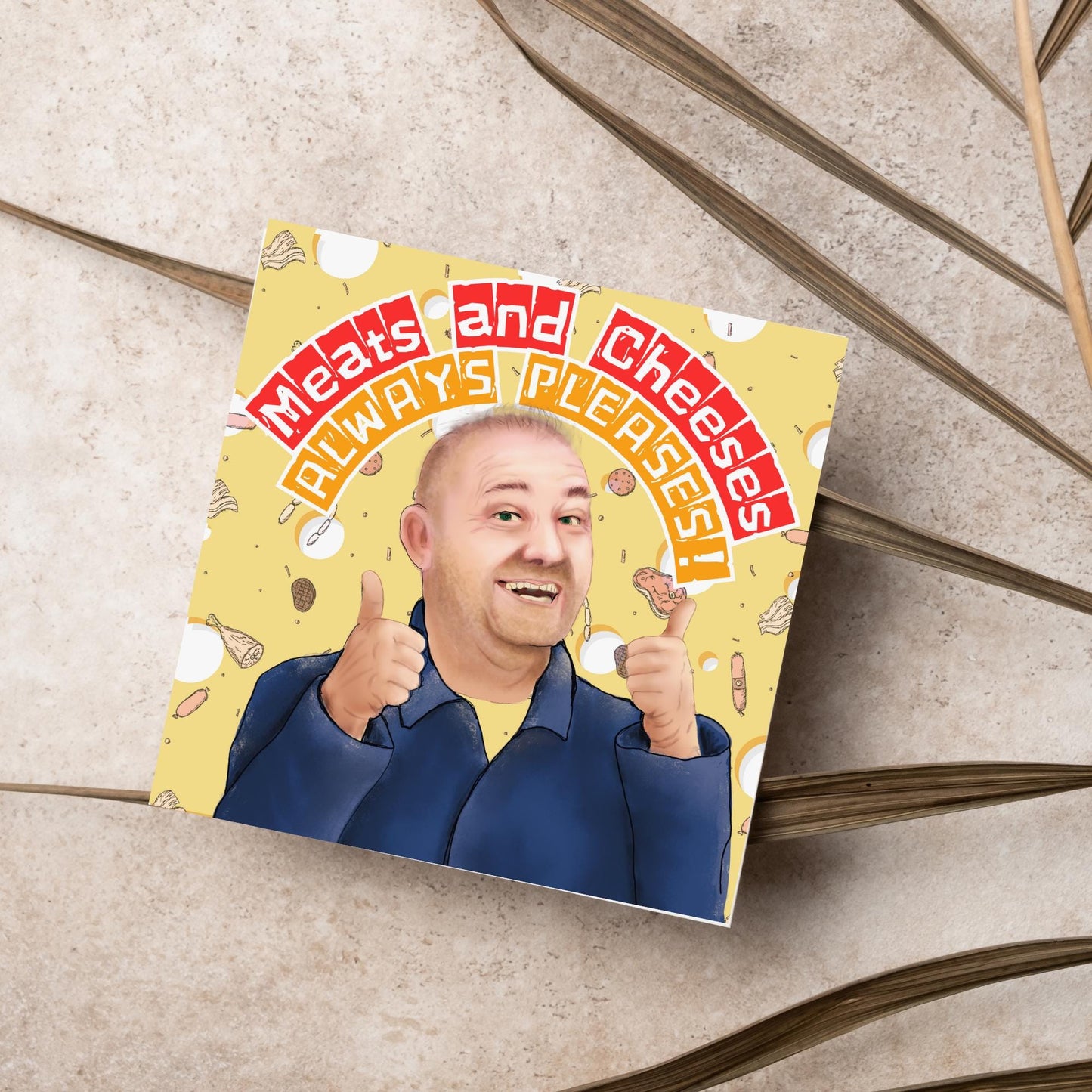 Square greeting card with a hand drawn image of Bob MOrtimer with 2 thumbs up against a backdrop of swiss cheese and various illustrations of different types of meat, with arched text that reads 'meats and cheeses always pleases'