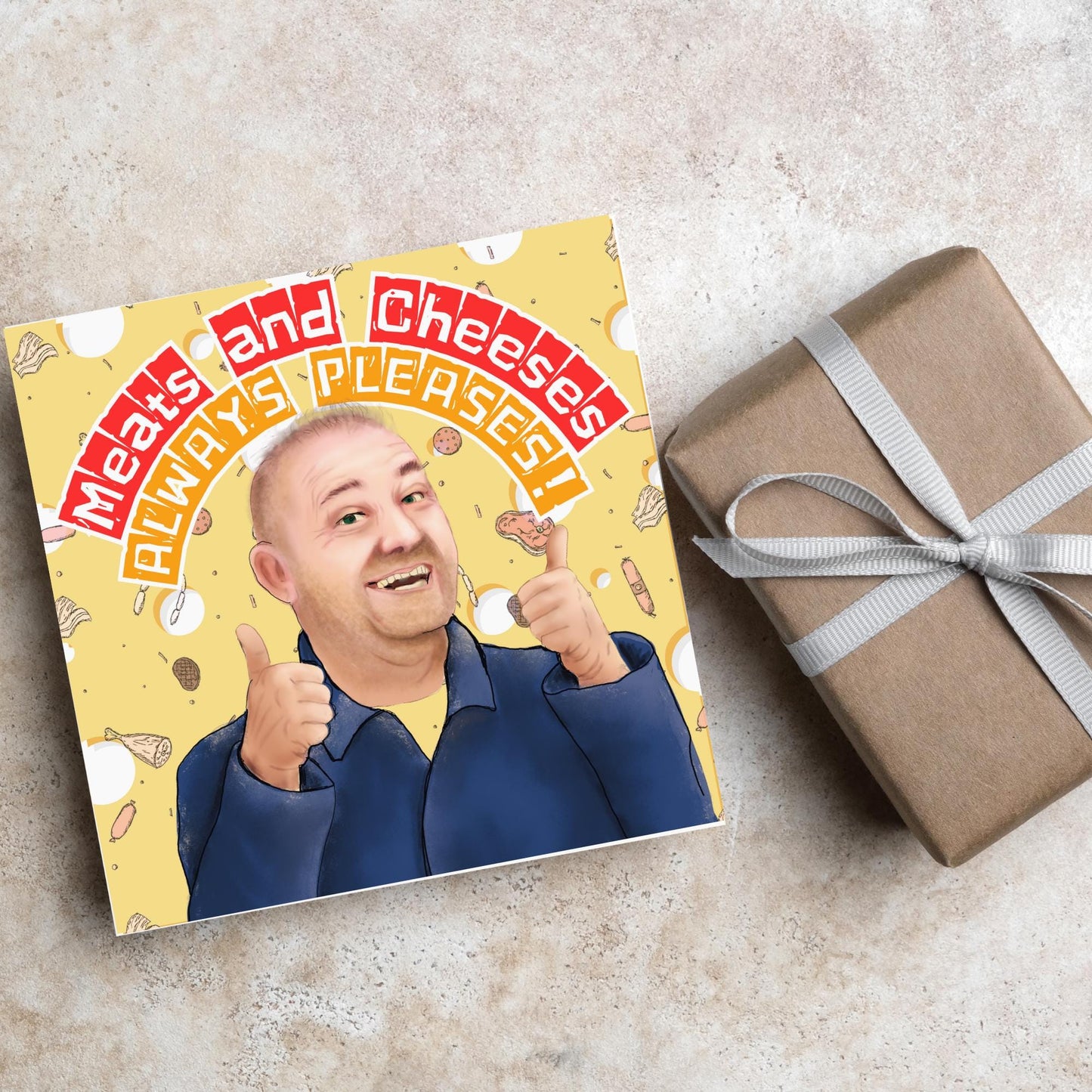 Square greeting card with a hand drawn image of Bob MOrtimer with 2 thumbs up against a backdrop of swiss cheese and various illustrations of different types of meat, with arched text that reads 'meats and cheeses always pleases'