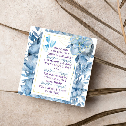 Square friendship card with &quot;Thank You for being the light in the dark
For making me smile when I don’t think I can
For reminding me there are better days ahead
For always staying by my side&quot; framed with blue watercolour flowers & hearts
