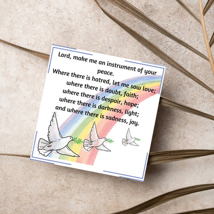 Square greetings card with 3 flying peace doves against a rainbow, with the Prayer of Saint Francis text Lord, make me an instrument of your peace.