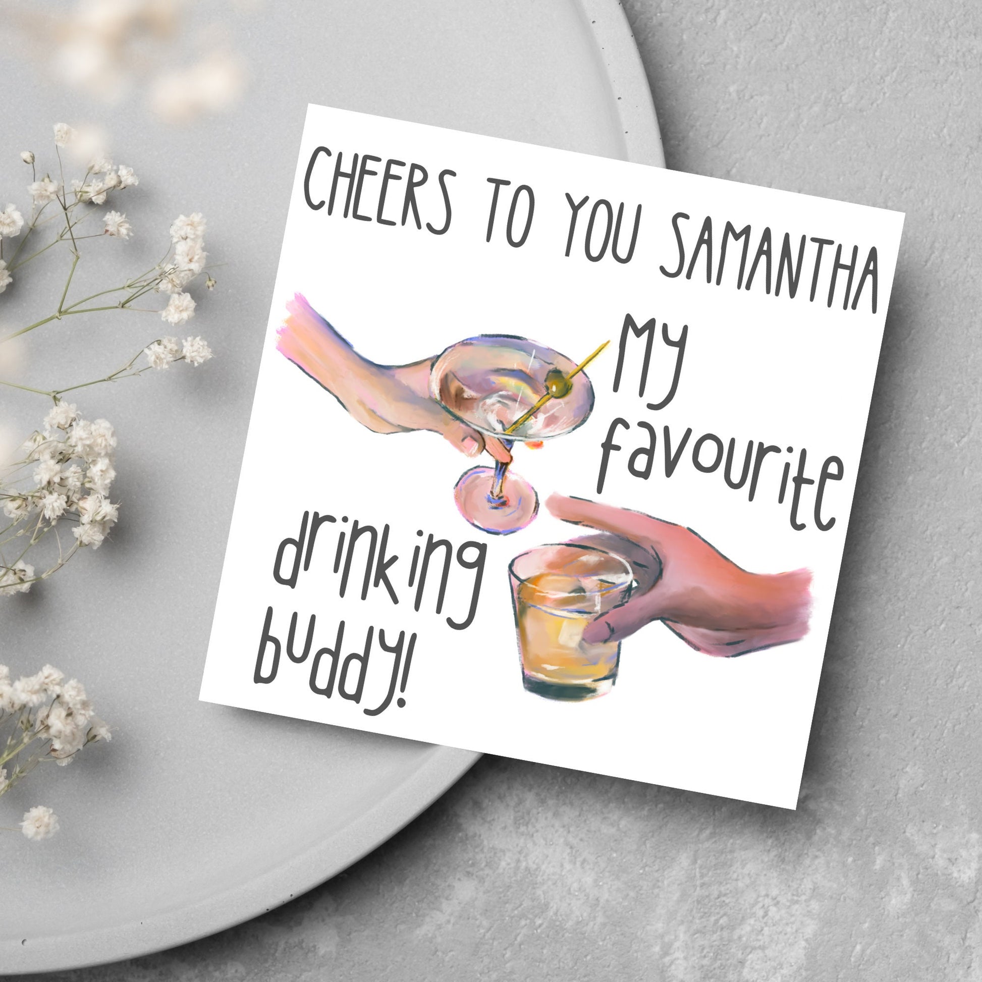 Square card with watercolour design of 2 hands holding drinks glasses against a white background, with grey text that reads &quot;cheers to you Samantha, my favourite drinking buddy&quot;