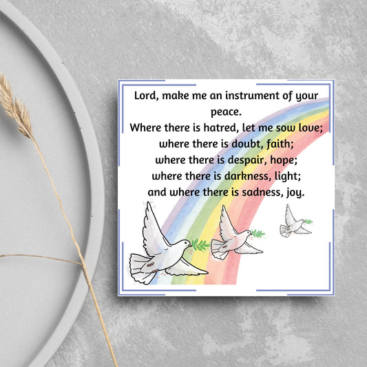 Square greetings card with 3 flying peace doves against a rainbow, with the Prayer of Saint Francis text Lord, make me an instrument of your peace.