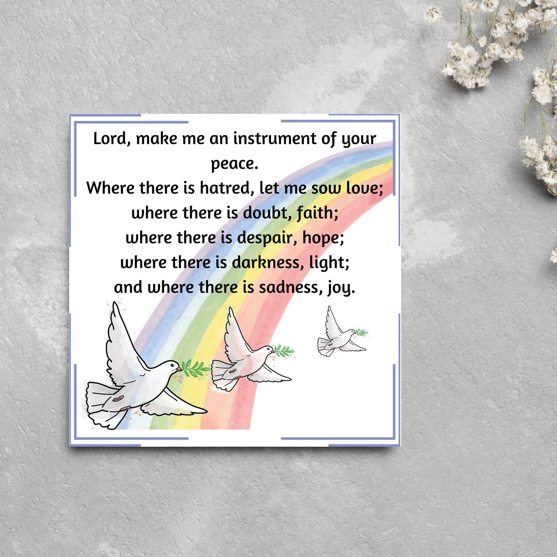 Square greetings card with 3 flying peace doves against a rainbow, with the Prayer of Saint Francis text Lord, make me an instrument of your peace.