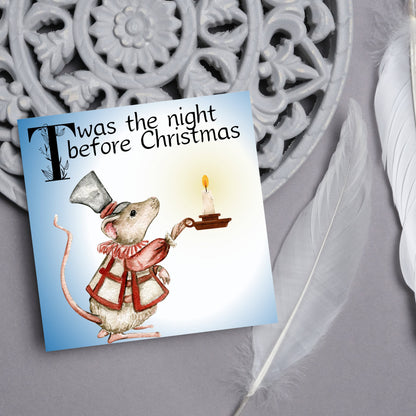 Square Christmas card with a Dickensian Mouse holding a candle in the dark. The mouse is dressed in Victorian clothes and the text &#39;twas the night before christmas&#39; is written across the top of the card