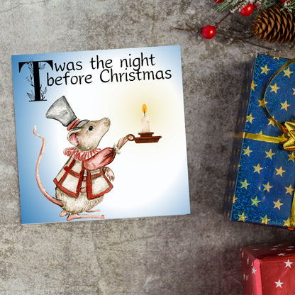 Square Christmas card with a Dickensian Mouse holding a candle in the dark. The mouse is dressed in Victorian clothes and the text &#39;twas the night before christmas&#39; is written across the top of the card