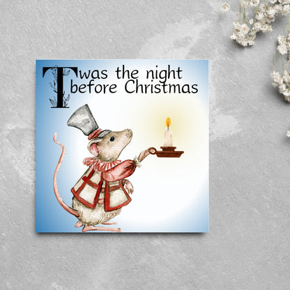 Square Christmas card with a Dickensian Mouse holding a candle in the dark. The mouse is dressed in Victorian clothes and the text &#39;twas the night before christmas&#39; is written across the top of the card