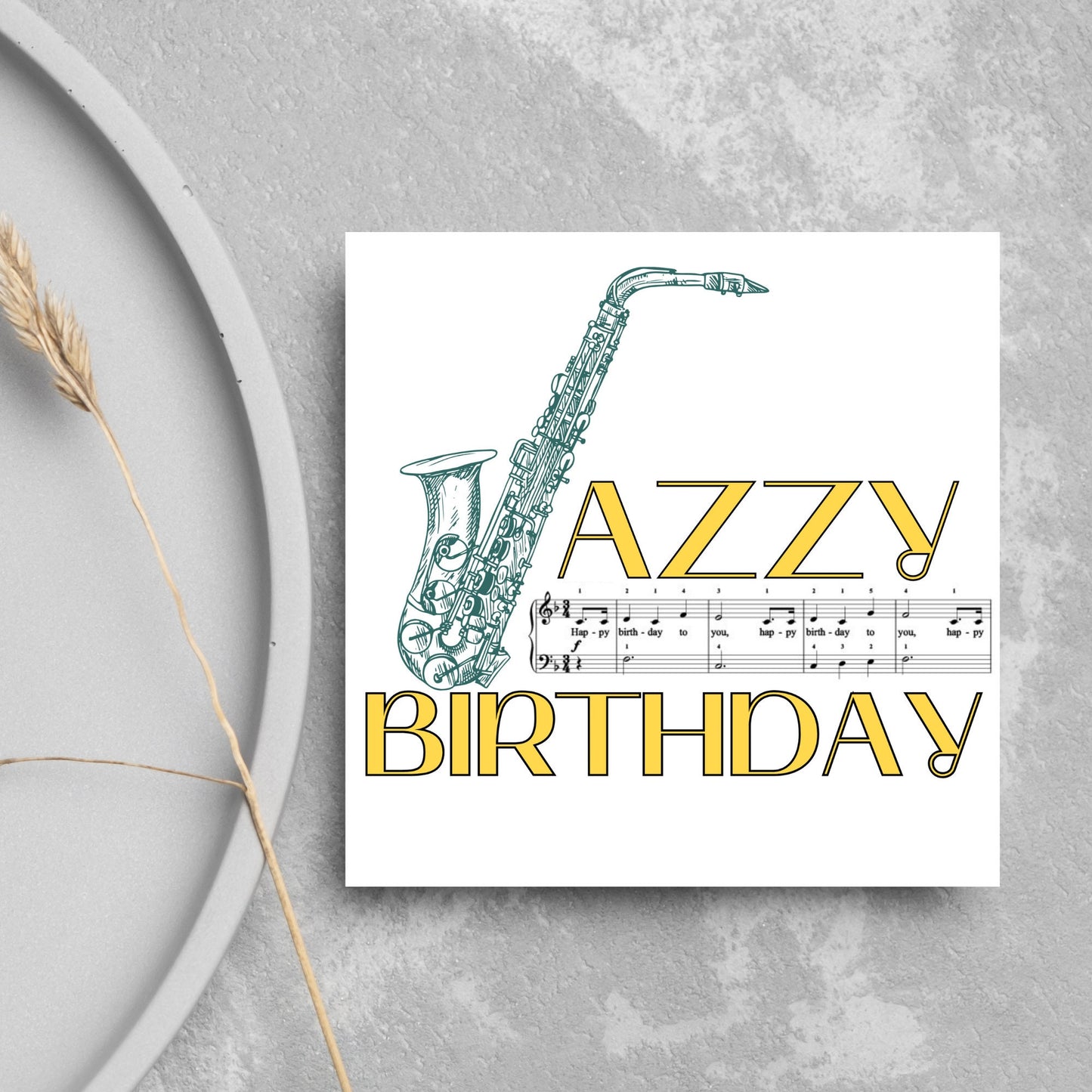 The Birthday Card has an image of a saxaphone in the shape of a &#39;J&#39; along with the word have a Jazzy Birthday. The Card depicts a music sheet of Happy Birthday. This Card is ideal for musicians