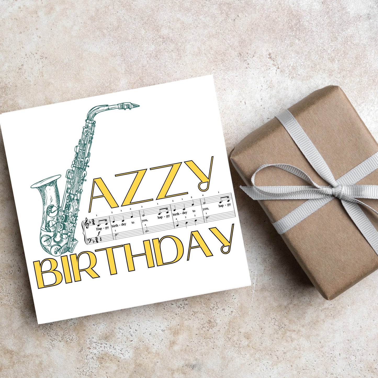 The Birthday Card has an image of a saxaphone in the shape of a &#39;J&#39; along with the word have a Jazzy Birthday. The Card depicts a music sheet of Happy Birthday. This Card is ideal for musicians