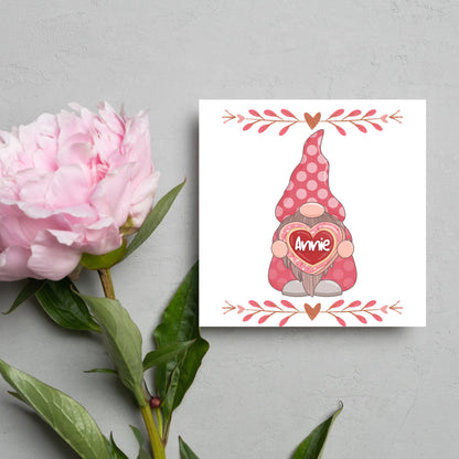 The Square Card has a cute gonk holding a love heart with a perssonalised name, the card has a cute heart header and footer, The Card is a cute representation of love, The Card is perfect for your valentines