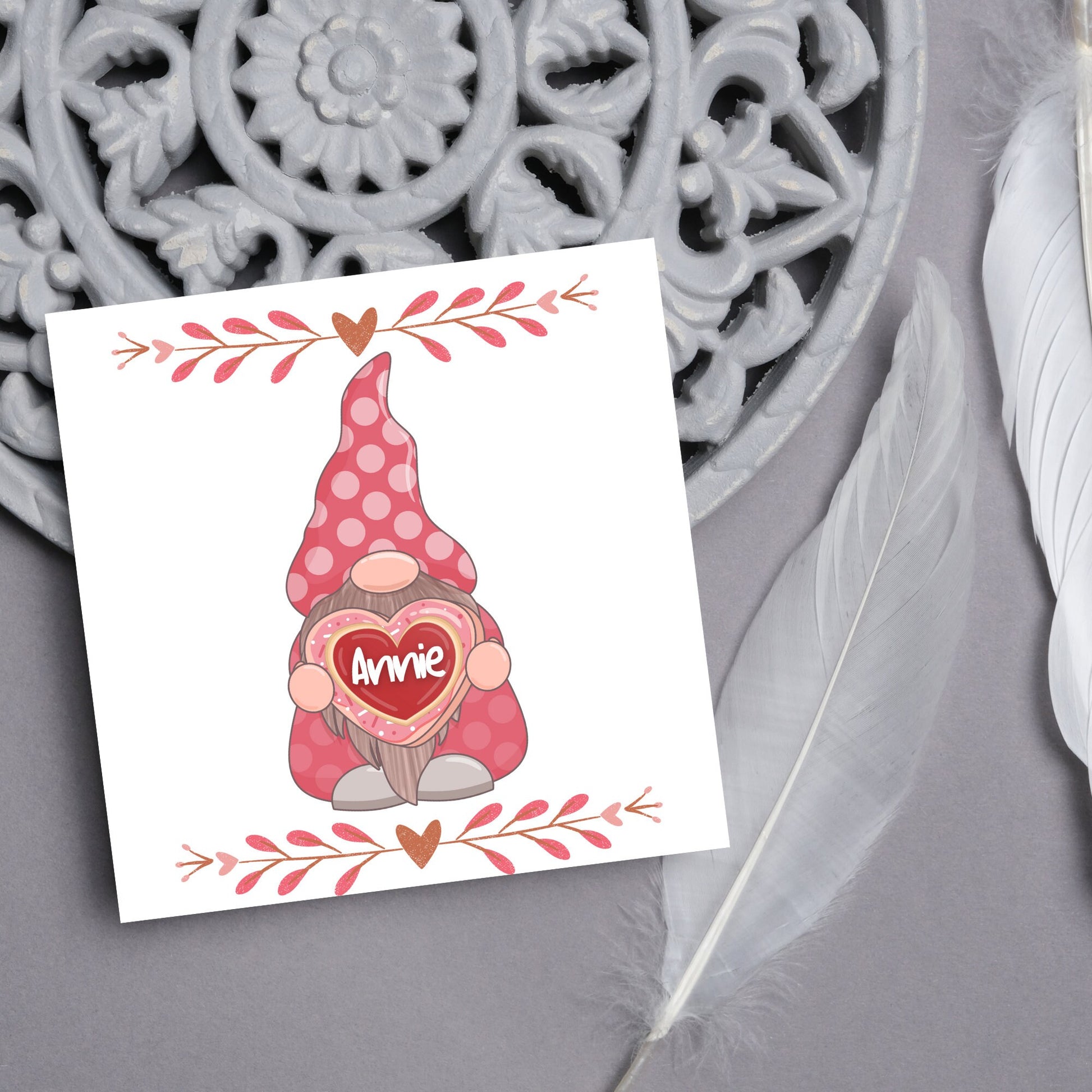 The Square Card has a cute gonk holding a love heart with a perssonalised name, the card has a cute heart header and footer, The Card is a cute representation of love, The Card is perfect for your valentines